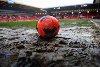 SHEFFIELD, ENGLAND - JANUARY 26:  A pink Nike Incyte ball is seen on the muddy pitch prior to the FA Cup with Budweiser fourth round match between Sheffield United and Fulham at Bramall Lane on January 26, 2014 in Sheffield, England.  (Photo by Michael Re