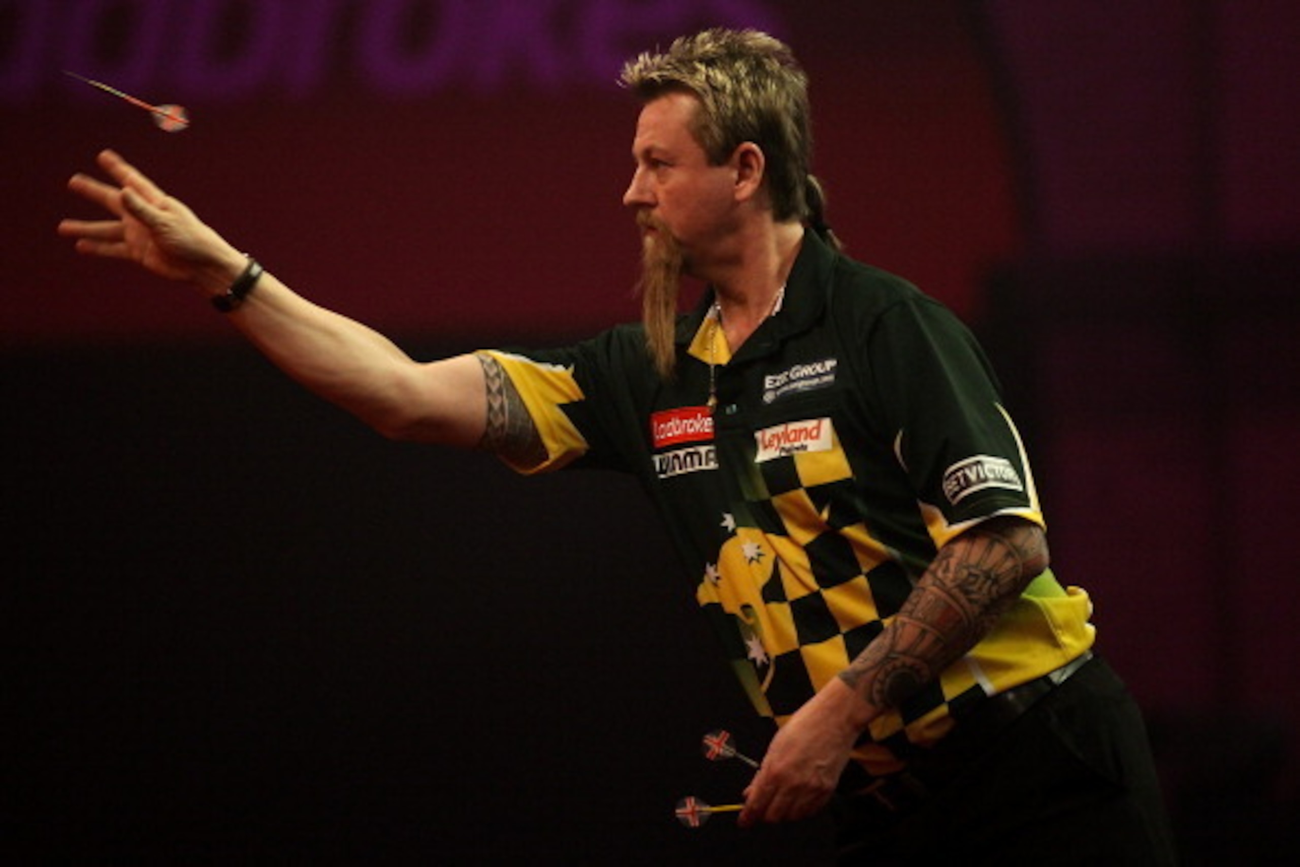 LONDON, ENGLAND - DECEMBER 30: Simon Whitlock of Australia in action during his semi final match against Peter Wright of Scotland on day fifteen of the Ladbrokes.com World Darts Championship at Alexandra Palace on December 30, 2013 in London, England.  (P