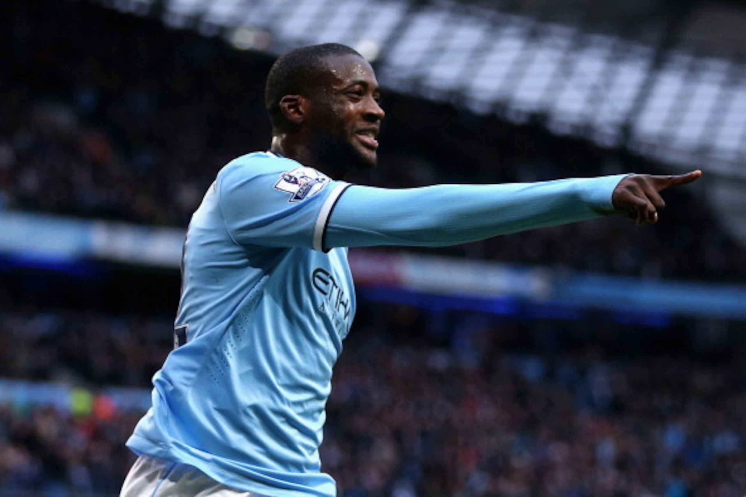 MANCHESTER, ENGLAND - FEBRUARY 22:  Yaya Toure of Manchester City celebrates scoring the opening goal during the Barclays Premier League match between Manchester City and Stoke City at the Etihad Stadium on February 22, 2014 in Manchester, England.  (Phot
