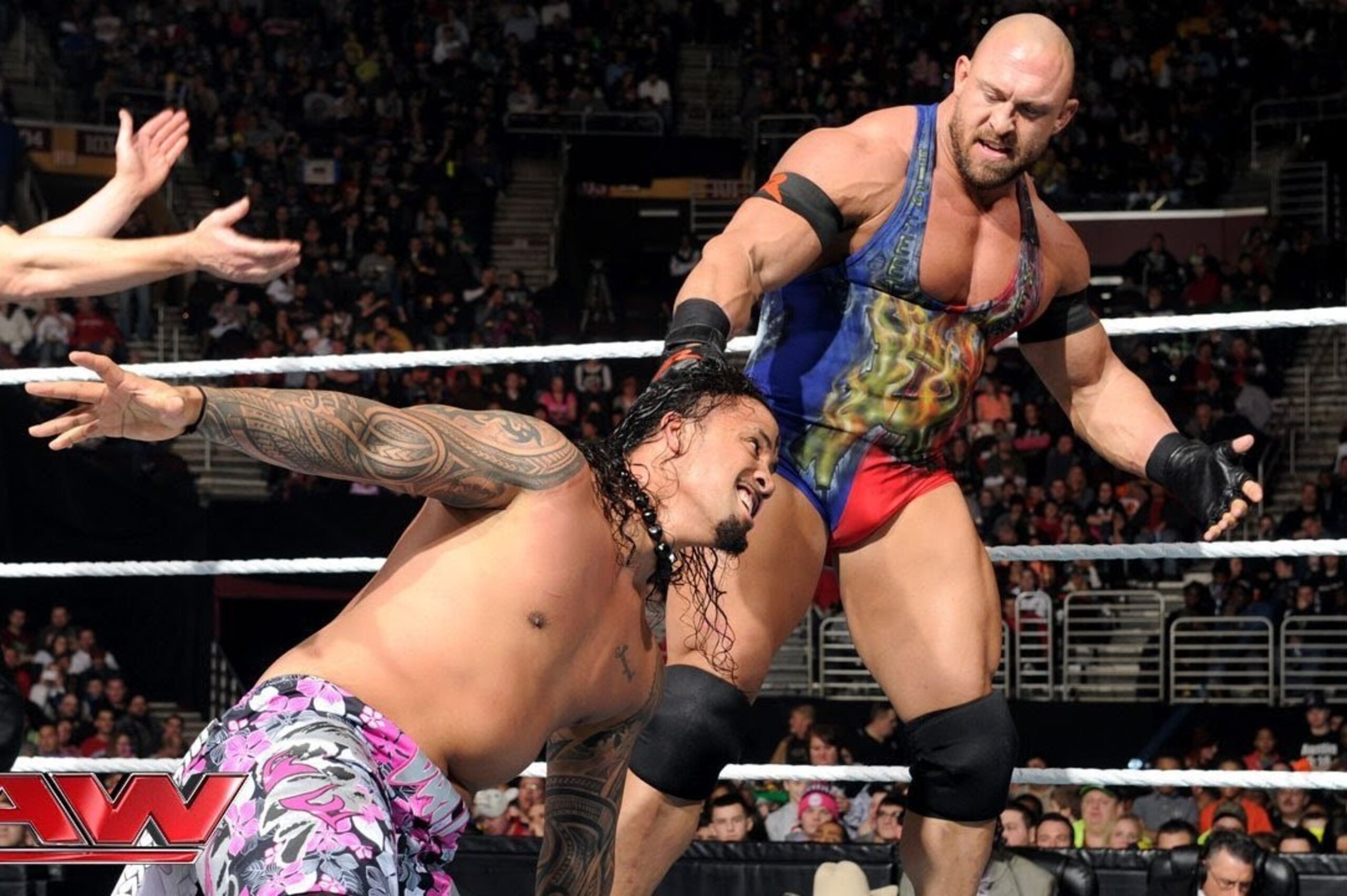 Ryback manhandles Jey Uso.