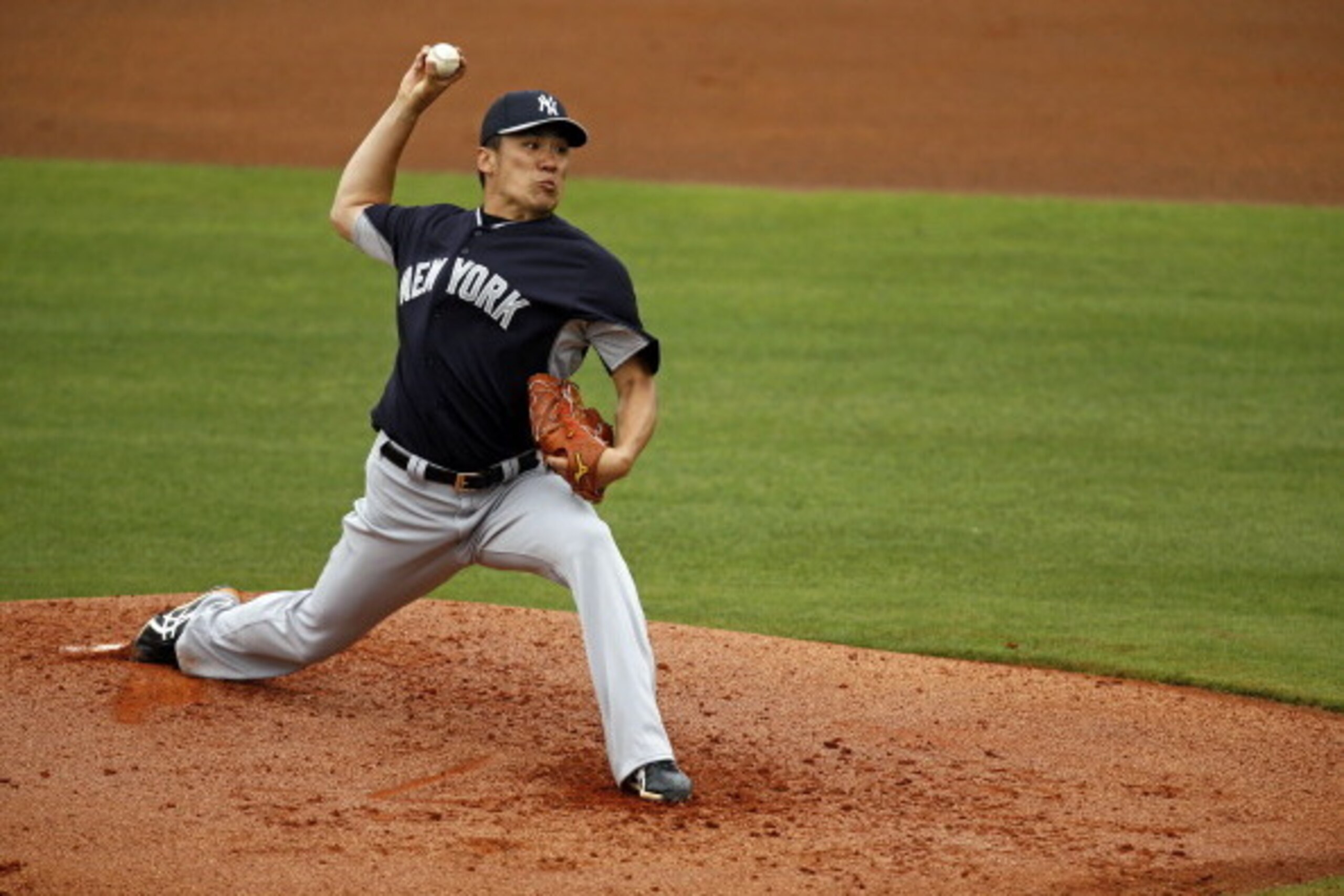 CLEARWATER, FL - MARCH 6:  Masahiro Tanaka #19 of the New York Yankees throws during a spring training game against the Philadelphia Phillies at Bright House Field on March 6, 2014 in Clearwater, Florida. (Photo by Mike Carlson/Getty Images)