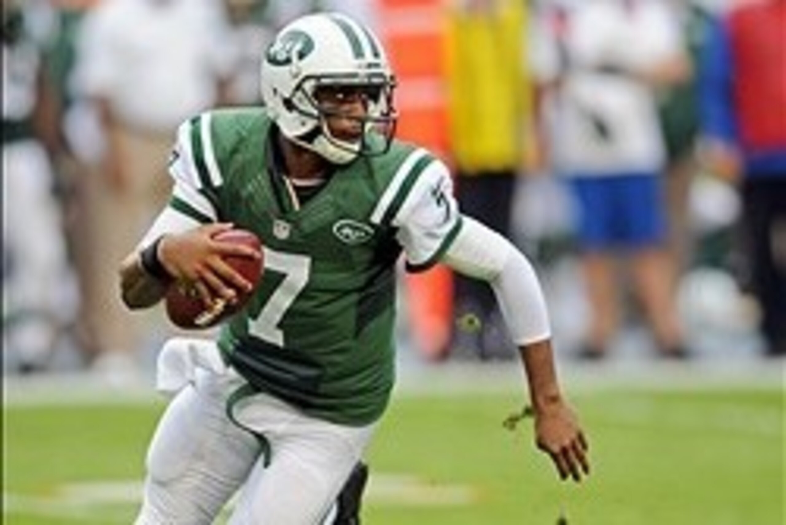 Dec 29, 2013; Miami Gardens, FL, USA; New York Jets quarterback Geno Smith (7) scrambles during the first half against the Miami Dolphins at Sun Life Stadium. Mandatory Credit: Steve Mitchell-USA TODAY Sports
