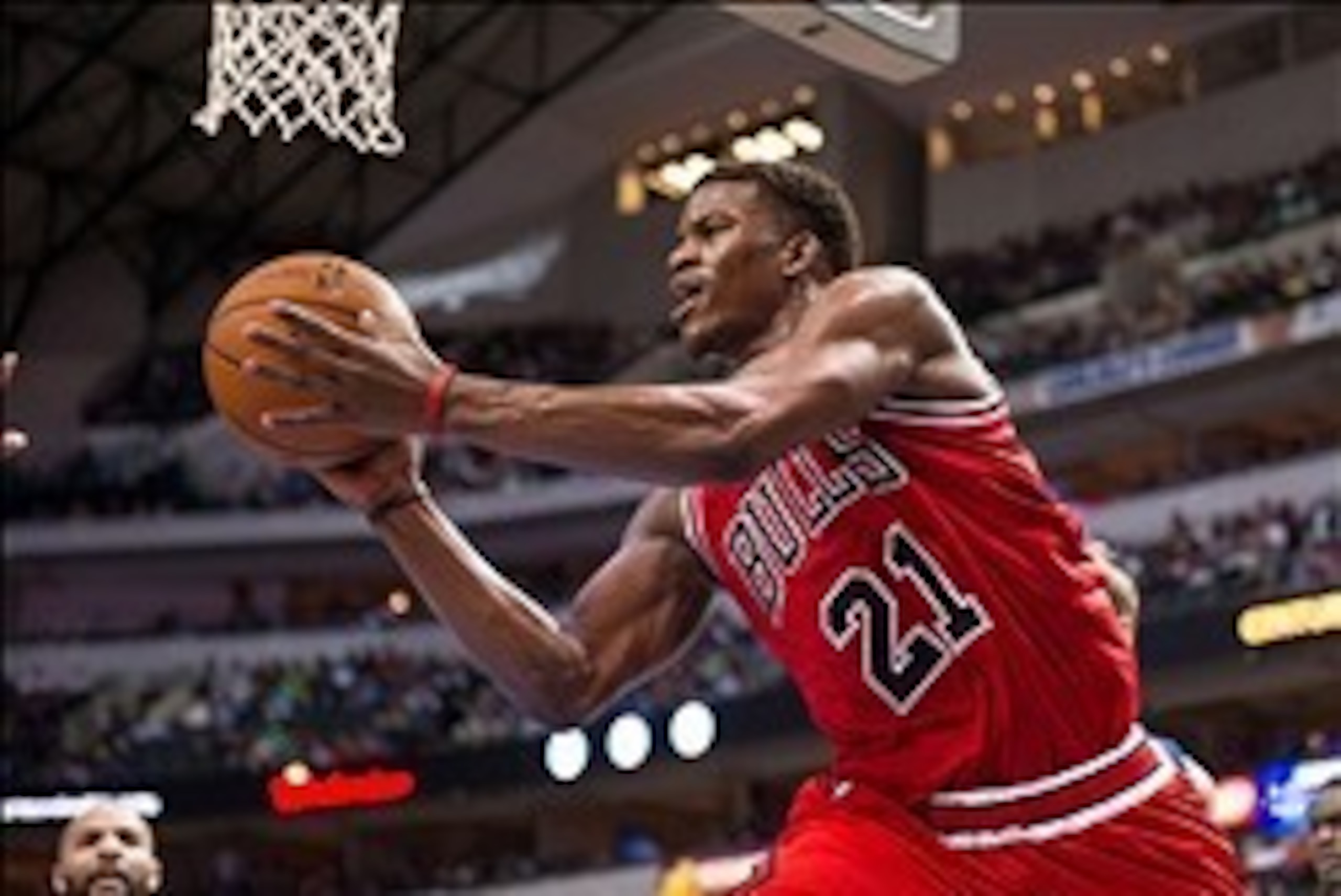 Feb 28, 2014; Dallas, TX, USA; Chicago Bulls shooting guard Jimmy Butler (21) passes the ball under the basket during the second half against the Dallas Mavericks at the American Airlines Center. The Bulls defeated the Mavericks 100-91. Mandatory Credit: