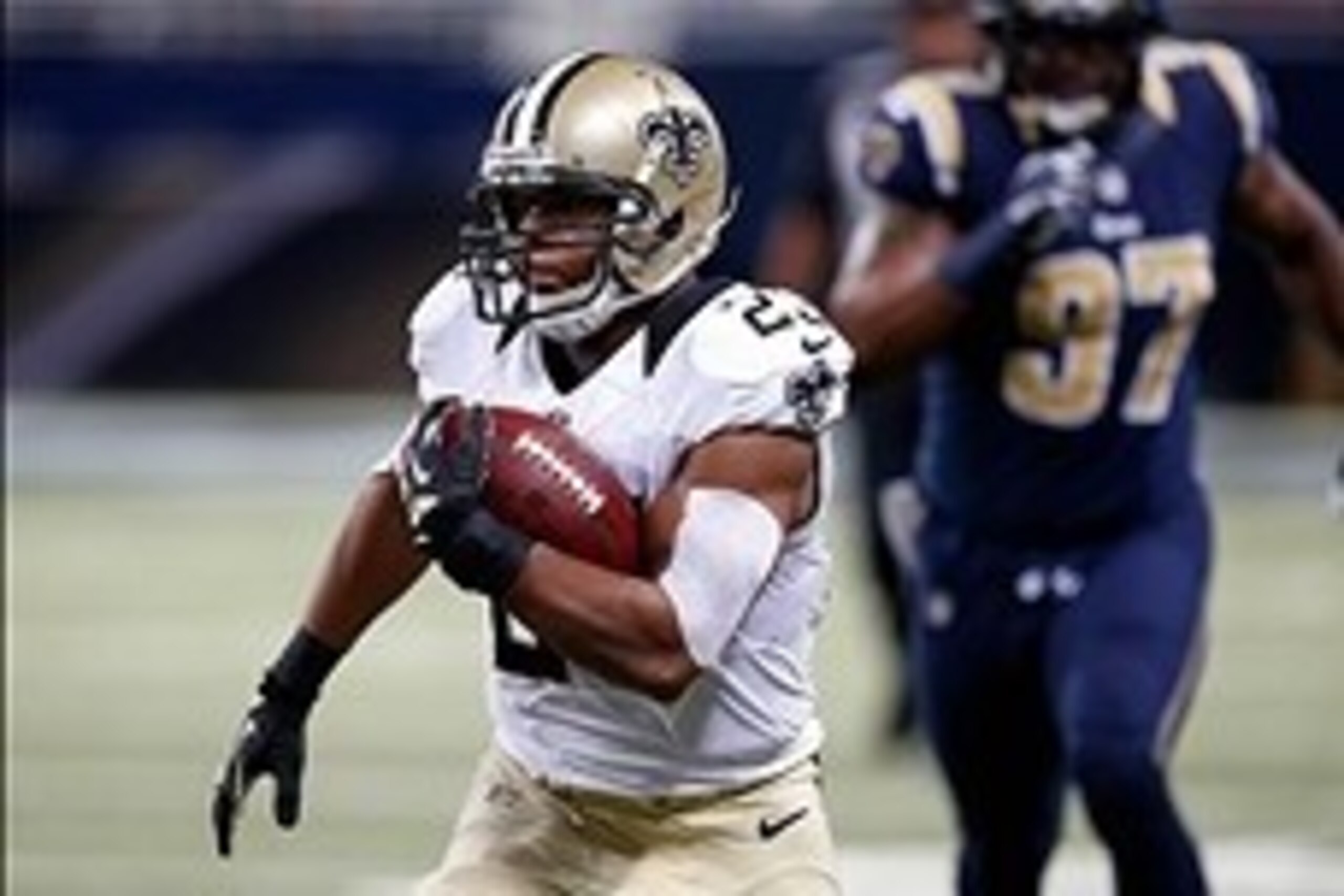 Dec 15, 2013; St. Louis, MO, USA; New Orleans Saints running back Pierre Thomas (23) carries the ball against the St. Louis Rams at the Edward Jones Dome. Mandatory Credit: Scott Kane-USA TODAY Sports