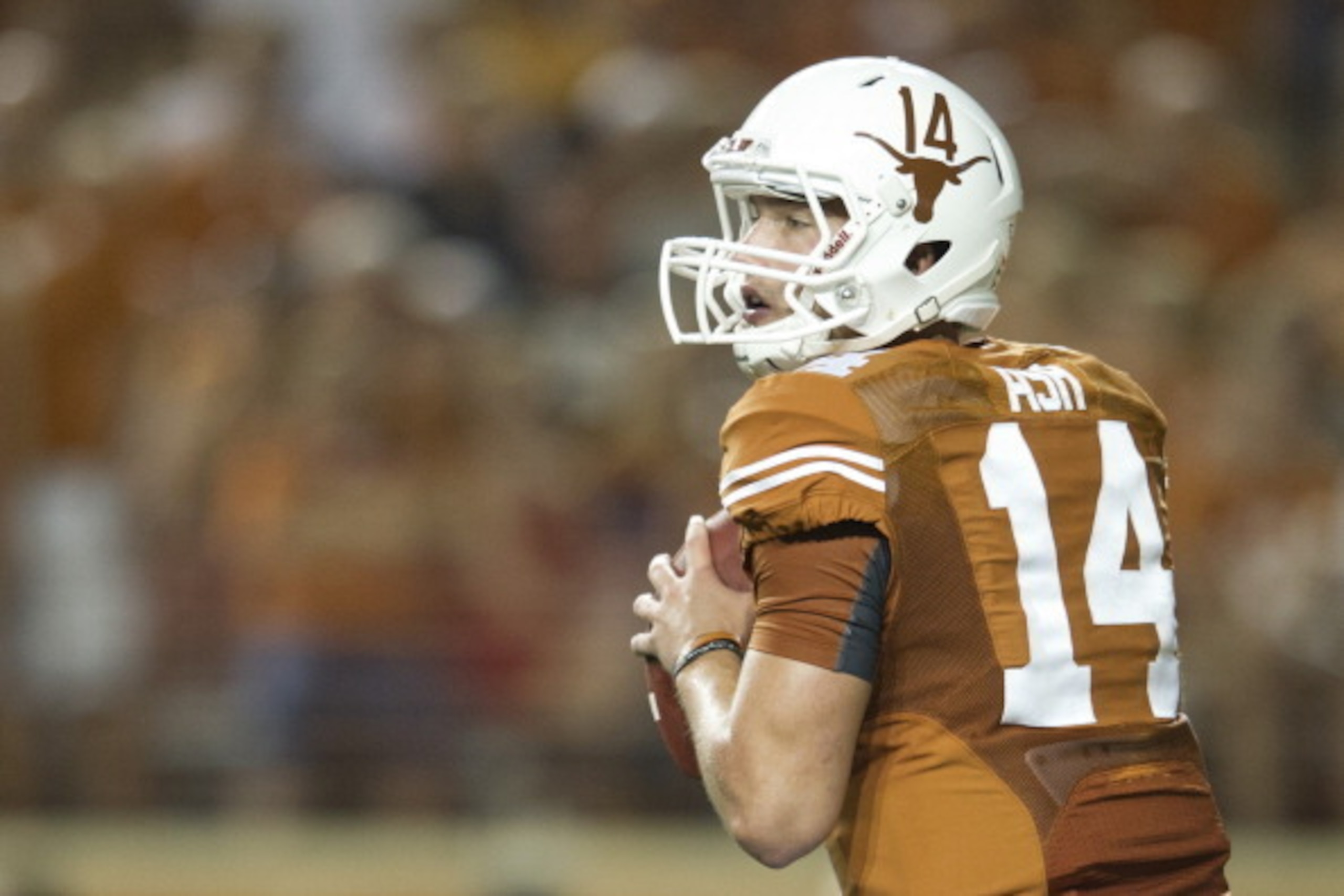 AUSTIN, TX - AUGUST 31: David Ash #14 of the Texas Longhorns throws a pass against the New Mexico State Aggies on August 31, 2013 at Darrell K Royal-Texas Memorial Stadium in Austin, Texas. (Photo by Cooper Neill/Getty Images)