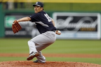 CLEARWATER, FL - MARCH 6:  Masahiro Tanaka #19 of the New York Yankees throws during a spring training game against the Philadelphia Phillies at Bright House Field on March 6, 2014 in Clearwater, Florida. (Photo by Mike Carlson/Getty Images)