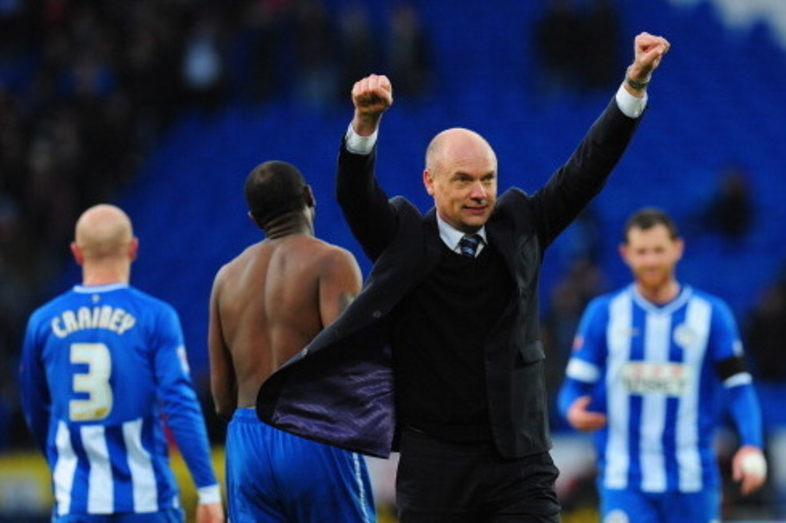 CARDIFF, WALES - FEBRUARY 15:  Wigan manager Uwe Rosler celebrates with the fans after the FA Cup Fifth Round match between Cardiff City and Wigan Athletic at Cardiff City Stadium on February 15, 2014 in Cardiff, Wales.  (Photo by Stu Forster/Getty Images