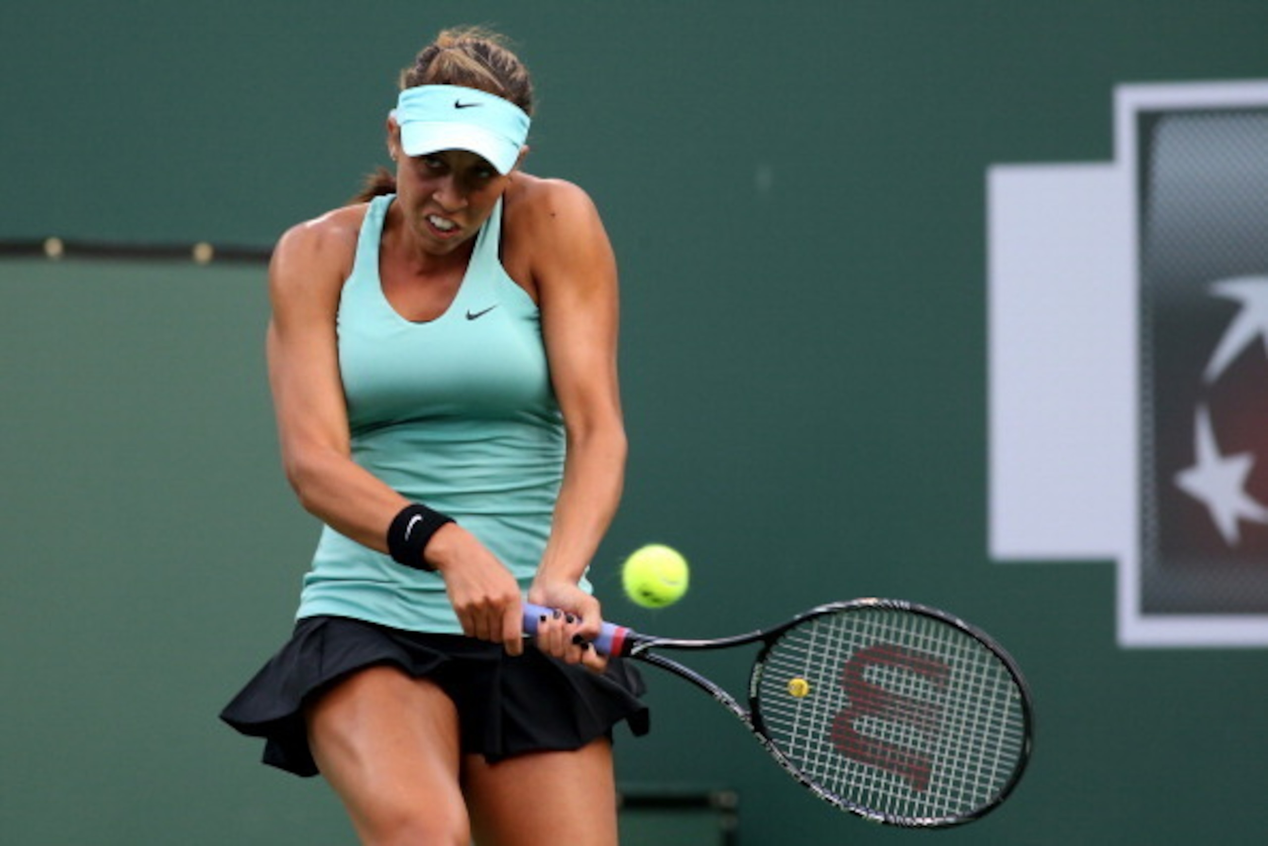 INDIAN WELLS, CA - MARCH 05:  Madison Keys hits a return to Tsvetana Pironkova of Bulgaria during the BNP Paribas Open at Indian Wells Tennis Garden on March 5, 2014 in Indian Wells, California. Keys won 6-2, 6-1.  (Photo by Stephen Dunn/Getty Images)