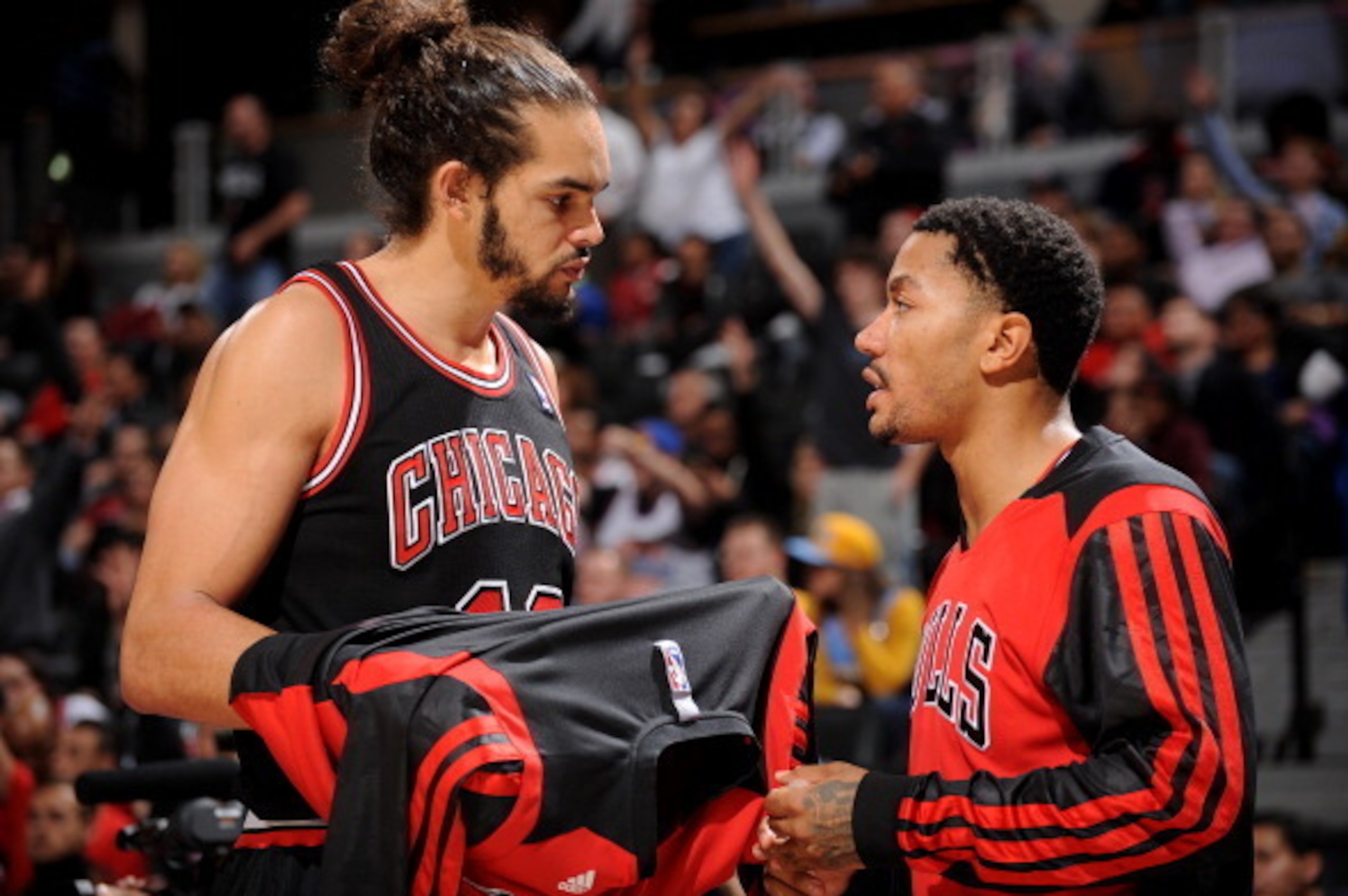 DENVER, CO - NOVEMBER 21:  Joakim Noah #13 and Derrick Rose #1 of the Chicago Bulls talk during the game against the Denver Nuggets on November 21, 2013 at the Pepsi Center in Denver, Colorado. NOTE TO USER: User expressly acknowledges and agrees that, by