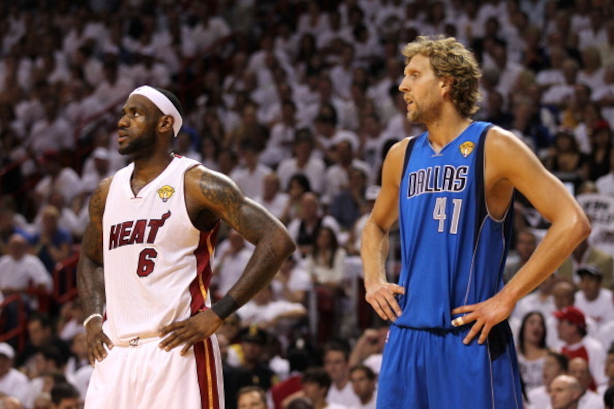 MIAMI, FL - JUNE 12: (L-R) LeBron James #6 of the Miami Heat and Dirk Nowitzki #41 of the Dallas Mavericks look on in Game Six of the 2011 NBA Finals at American Airlines Arena on June 12, 2011 in Miami, Florida. The Mavericks won 105-95. NOTE TO USER: Us