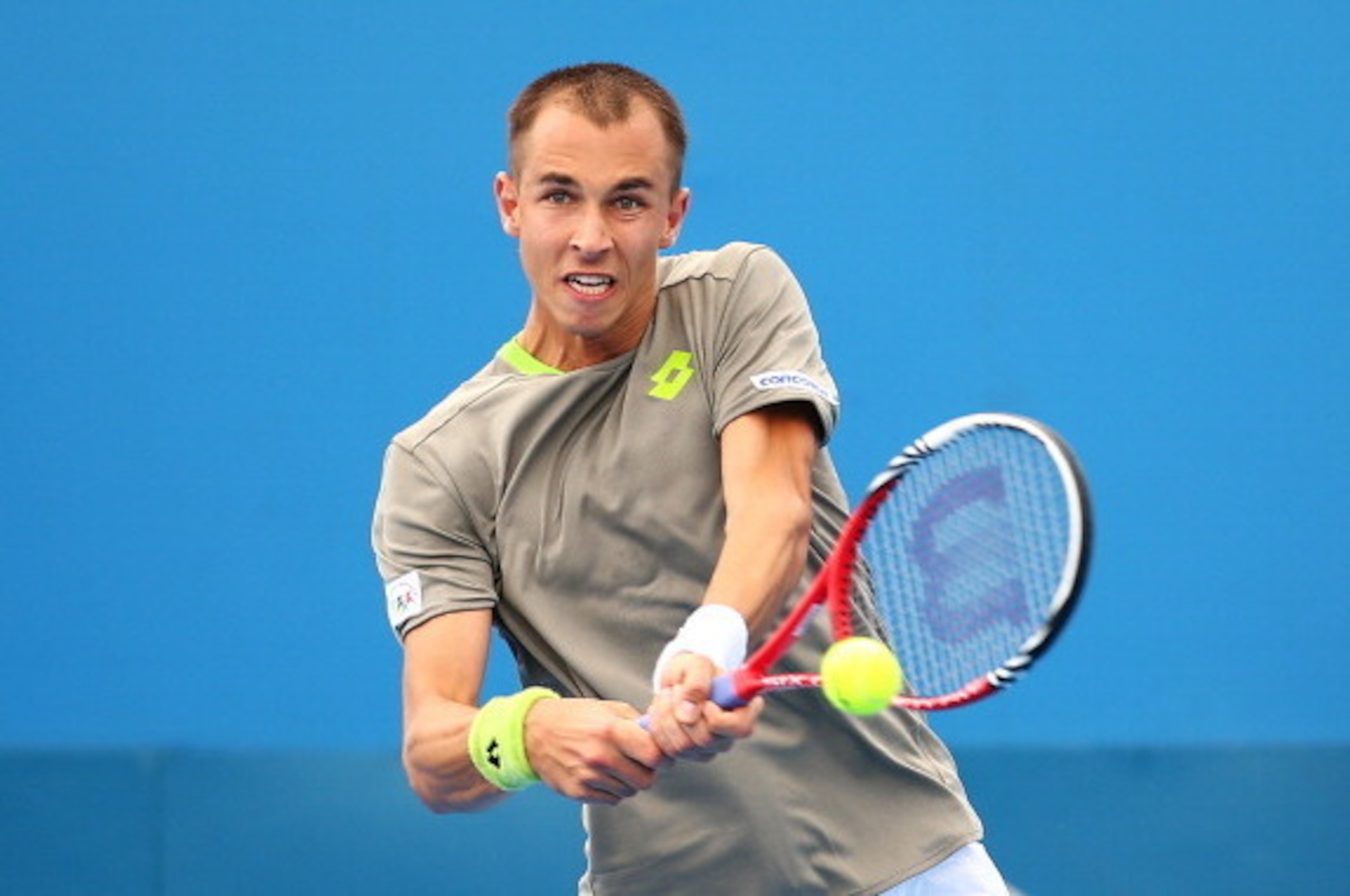 SYDNEY, AUSTRALIA - JANUARY 08: Lukas Rosol of the Czech Republic plays a backhand in his match against Dmitry Tursunov of Russia during day four of the 2014 Sydney International at Sydney Olympic Park Tennis Centre on January 8, 2014 in Sydney, Australi SYDNEY, AUSTRALIA - JANUARY 08: Lukas Rosol of the Czech Republic plays a backhand in his match against Dmitry Tursunov of Russia during day four of the 2014 Sydney International at Sydney Olympic Park Tennis Centre on January 8, 2014 in Sydney, Australi