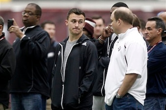 Johnny Manziel on the sidelines at the Texas A&M Pro Day as he has a personal workout set for March 27