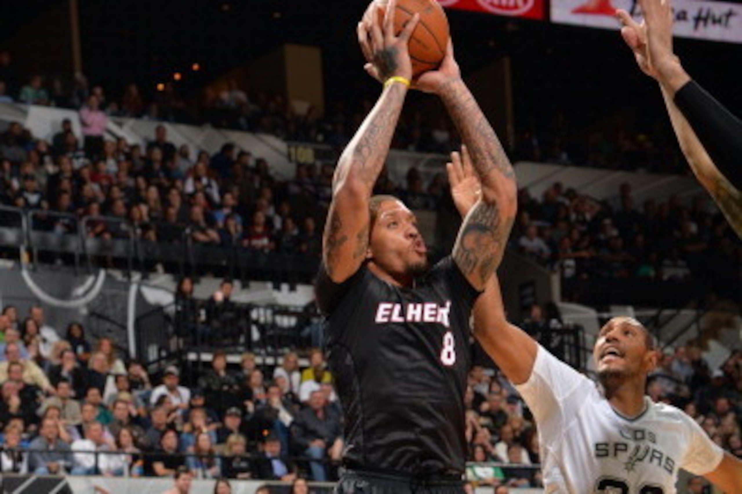 SAN ANTONIO, TX - MARCH 6: Michael Beasley #8 of the Miami Heat takes a shot during a game against the San Antonio Spurs at the AT&T Center March 6, 2014 in San Antonio, Texas. NOTE TO USER: User expressly acknowledges and agrees that, by downloading and 