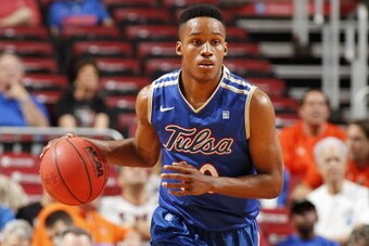 SUNRISE, FL - DECEMBER 29: James Woodard #10 of the Tulsa Golden Hurricane brings the ball up court against the Florida State Seminoles at the MetroPCS Orange Bowl Basketball Classic on December 29, 2012 at the BB&T Center in Sunrise, Florida. The Seminol