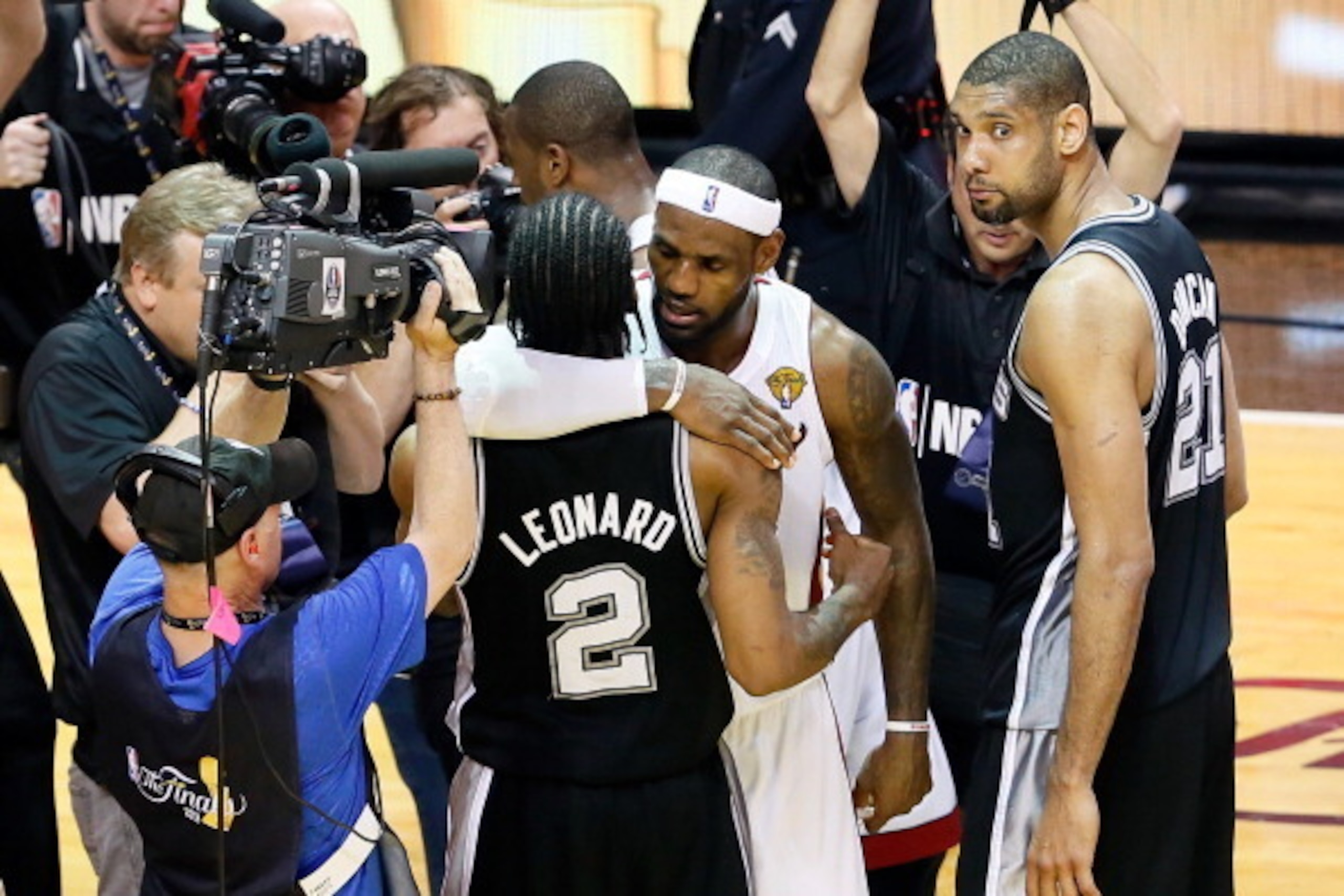 MIAMI, FL - JUNE 20:  LeBron James #6 of the Miami Heat hugs Kawhi Leonard #2 of the San Antonio Spurs after the Heat defeat the Spurs 95-88 in Game Seven of the 2013 NBA Finals at AmericanAirlines Arena on June 20, 2013 in Miami, Florida. NOTE TO USER: U