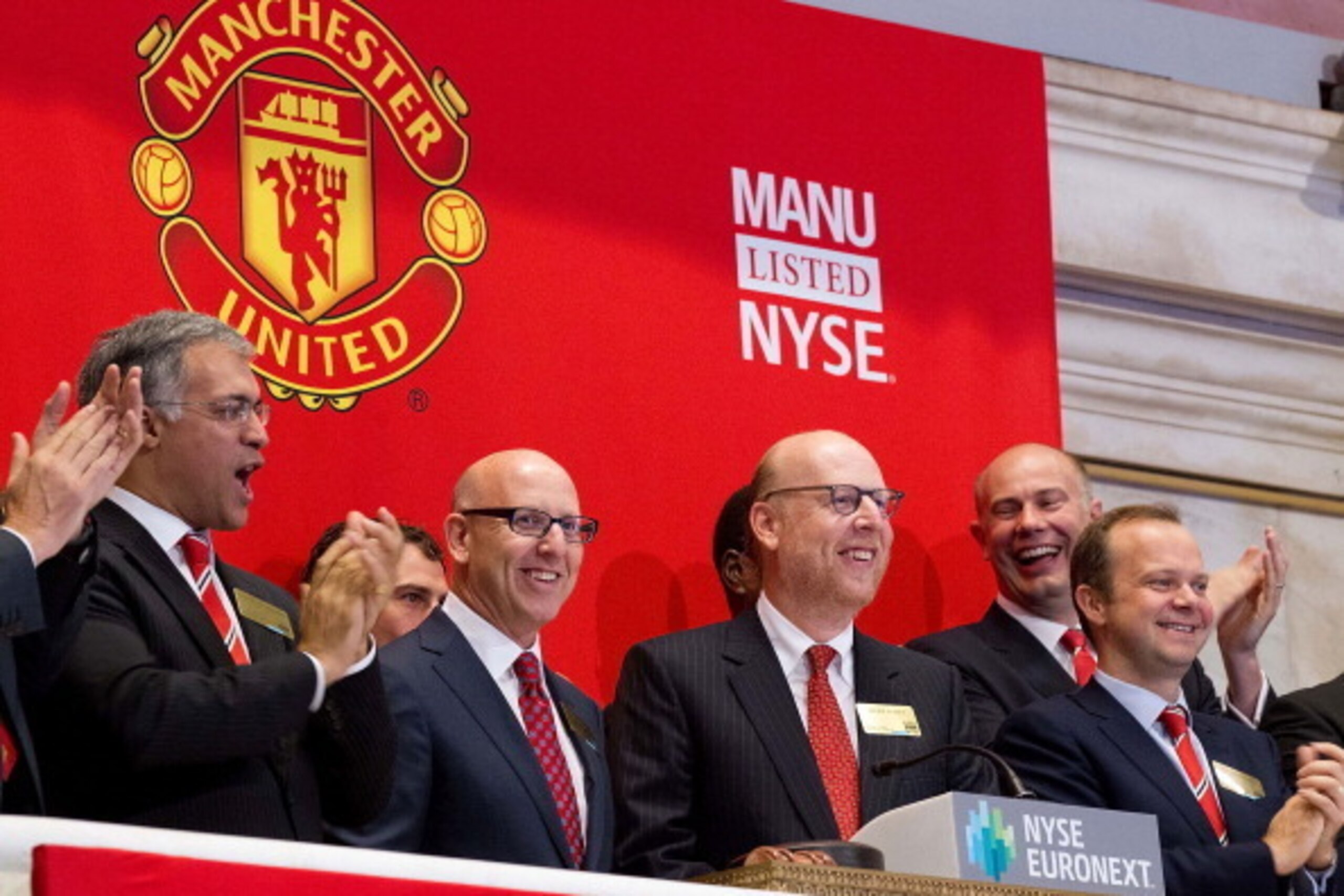 NEW YORK, NY - AUGUST 10:  In this handout photo provided by the NYSE Euronext, Manchester United Executives Joel Glazer (2nd L) and Avram Glazer (C) and Ed Woodward prepare to ring the Opening Bell at the New York Stock Exchange on August 10, 2012 in New