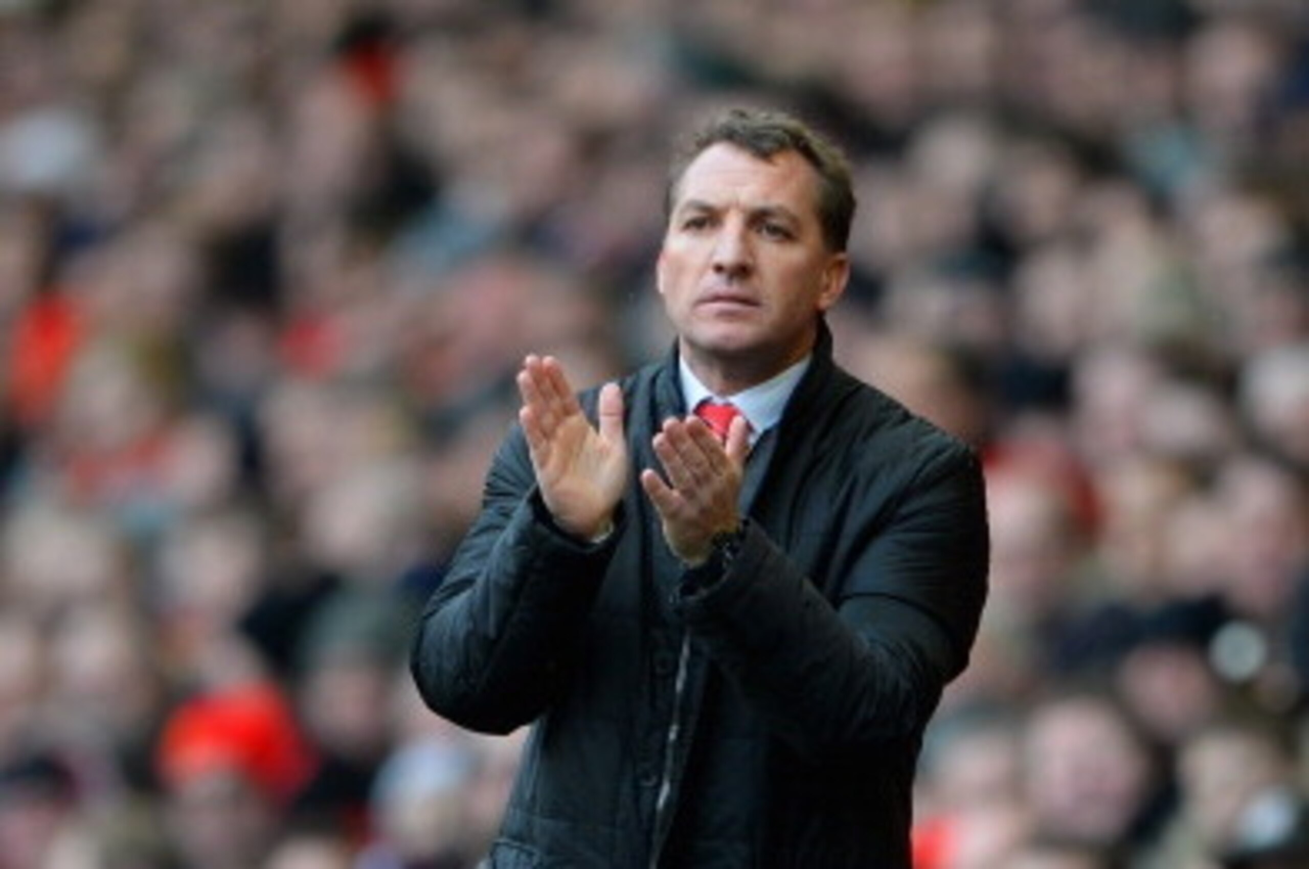 LIVERPOOL, ENGLAND - FEBRUARY 08:  Liverpool Manager Brendan Rodgers applauds during the Barclays Premier League match between Liverpool and Arsenal at Anfield on February 8, 2014 in Liverpool, England.  (Photo by Michael Regan/Getty Images)