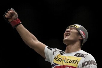 MACAU - MARCH 01:  Dong Hyun Kim of South Korea celebrates after defeating John Hathaway of England by knockout in their welterweight bout during the UFC Fight Night at the Cotai Arena on March 1, 2014 in Macau, China.  (Photo by Victor Fraile/Getty Image