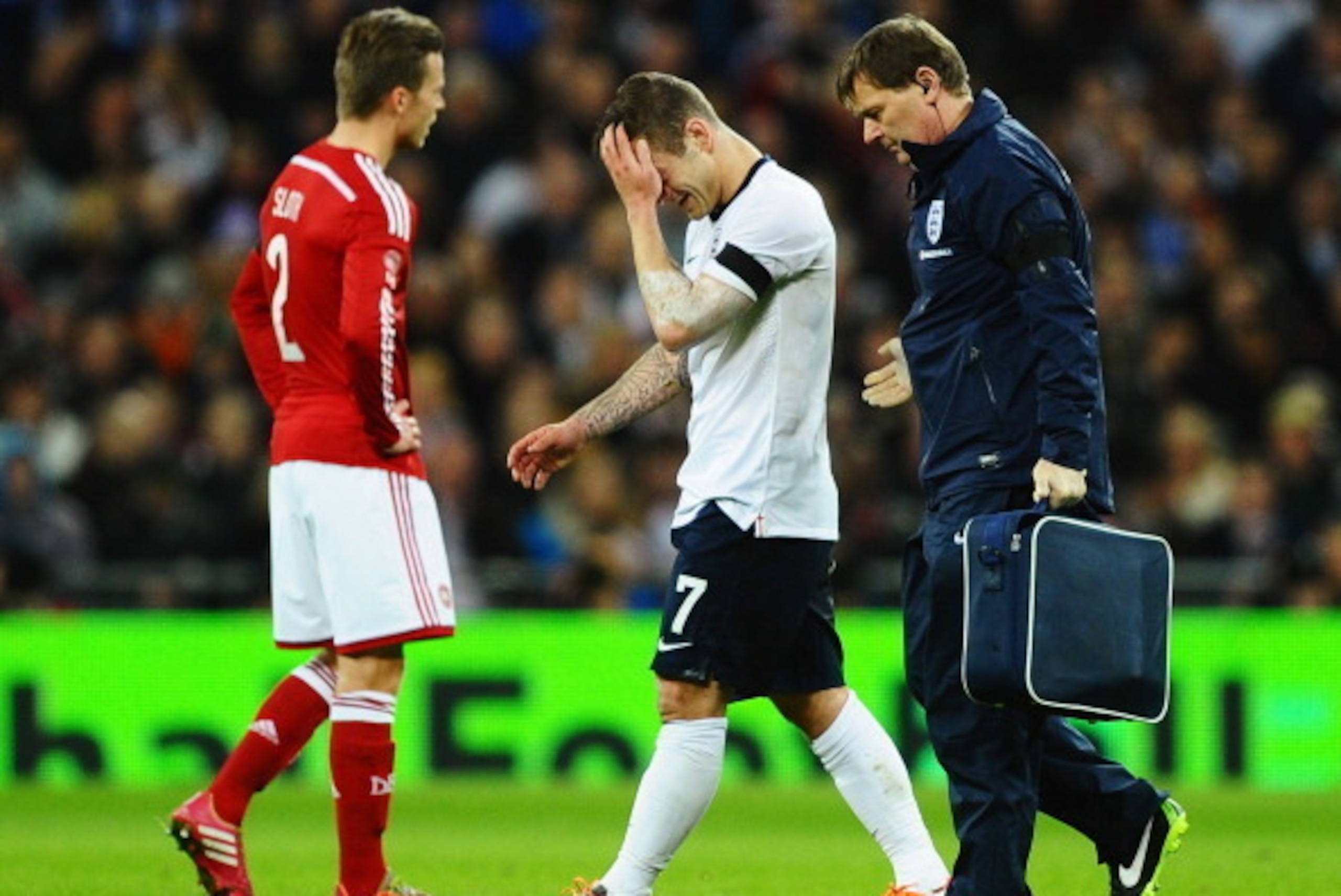 LONDON, ENGLAND - MARCH 05:  Jack Wilshere of England leaves the field after receiving treatment during the International Friendly match between England and Denmark at Wembley Stadium on March 5, 2014 in London, England.  (Photo by Laurence Griffiths/Gett