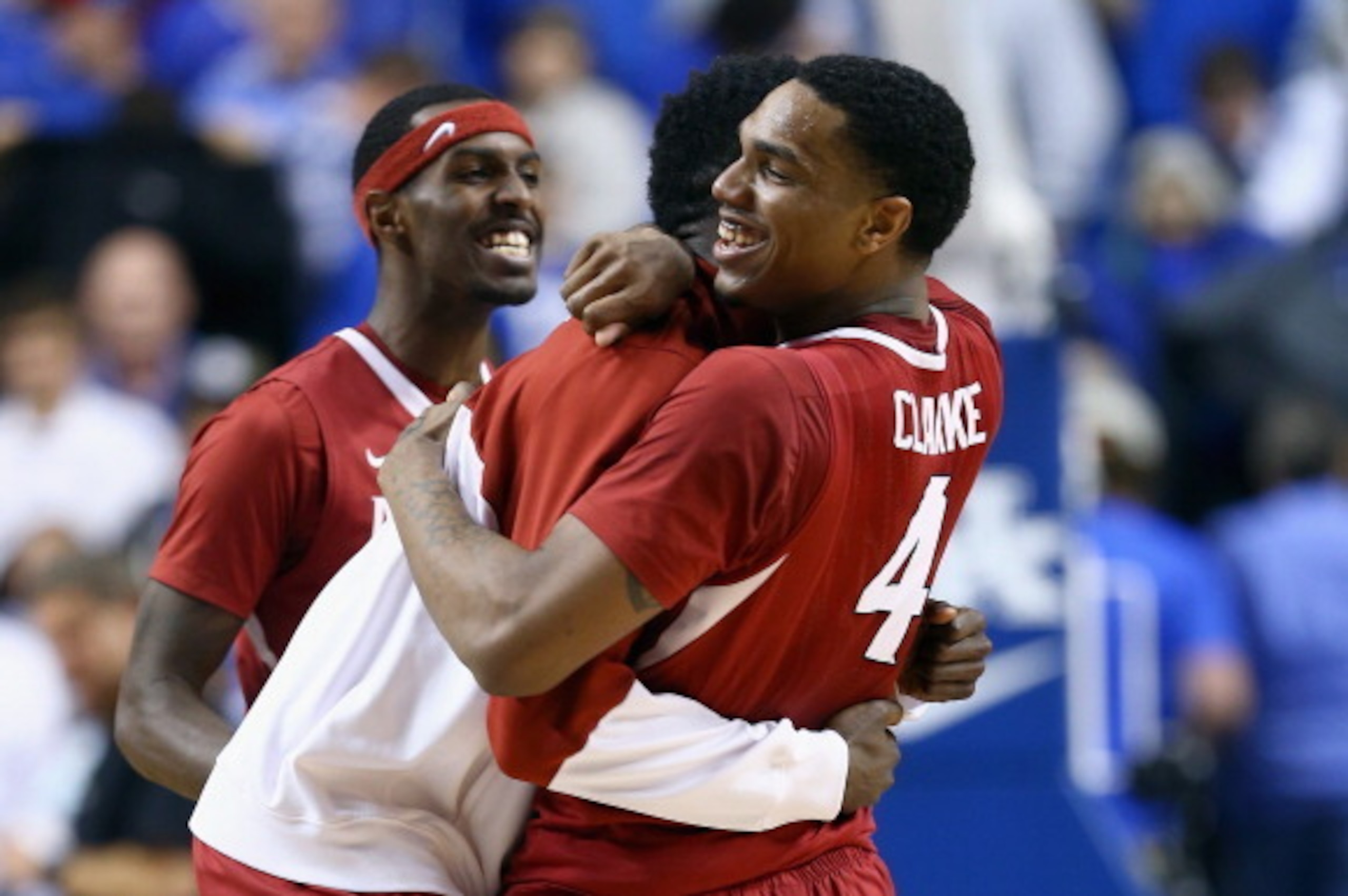 LEXINGTON, KY - FEBRUARY 27:  Coty Clarke #4 of the Arkansas Razorbacks celebrates with a teammate  after the 71-67 OT win over the Kentucky Wildcats at Rupp Arena on February 27, 2014 in Lexington, Kentucky.  (Photo by Andy Lyons/Getty Images)