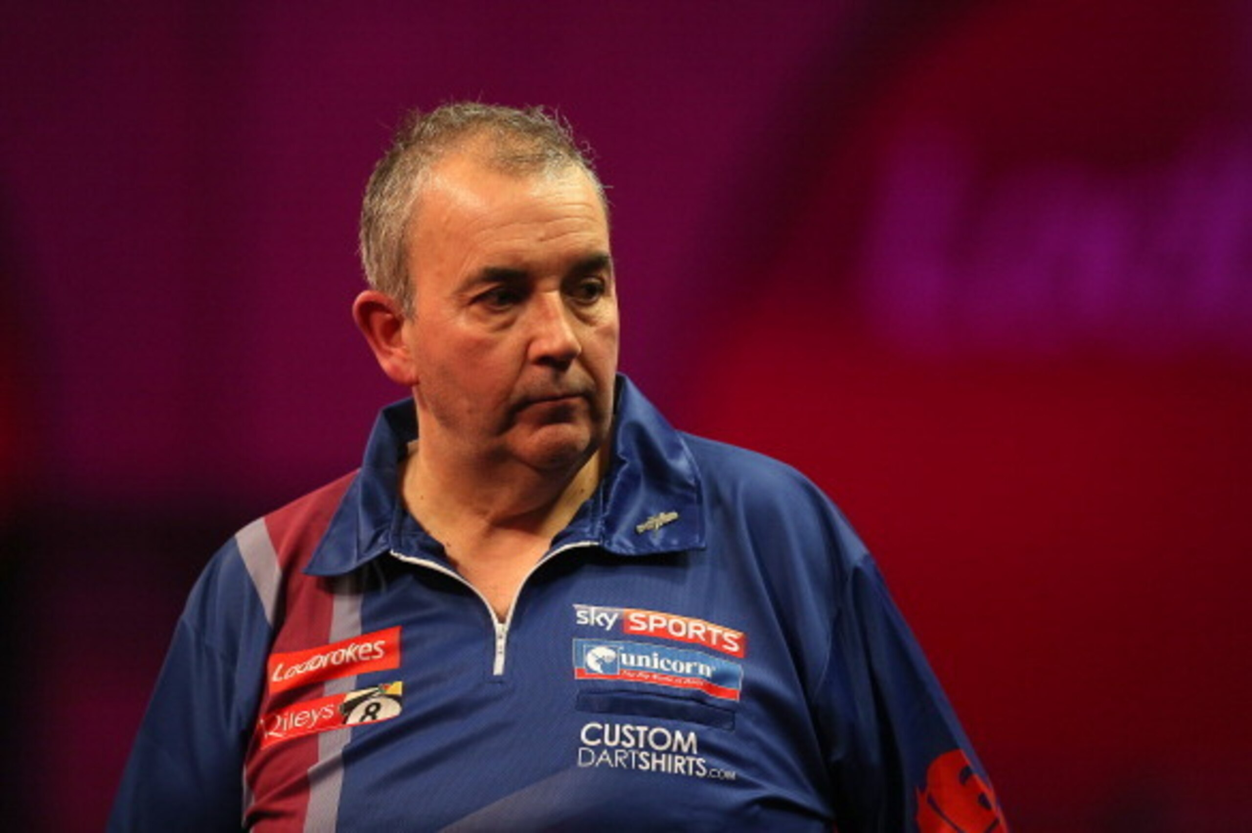 LONDON, ENGLAND - DECEMBER 20: Phil Taylor of England looks on during his second round match against Michael Smith of England during the Ladbrokes.com World Darts Championship on Day Eight at Alexandra Palace on December 20, 2013 in London, England. (Phot