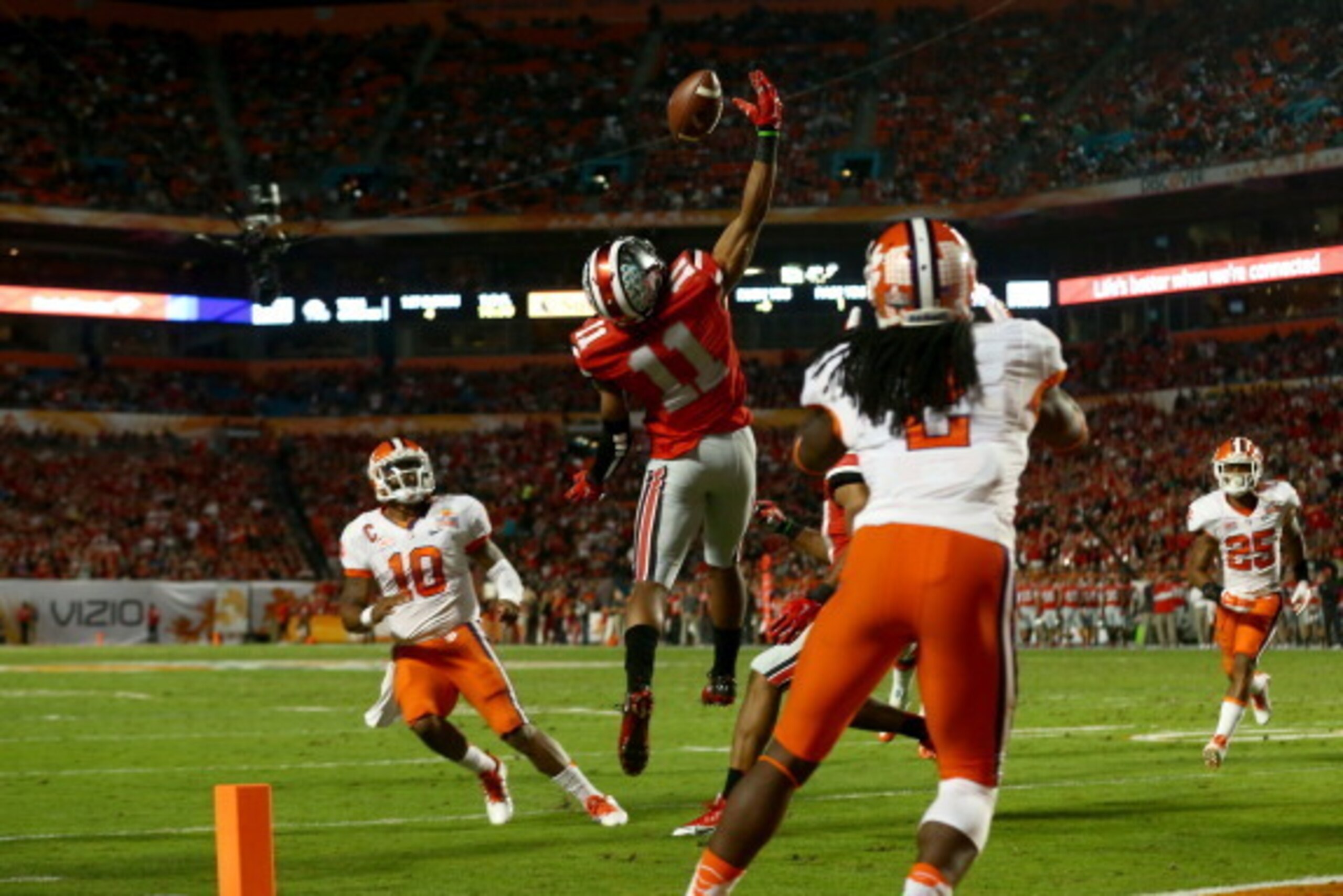 MIAMI GARDENS, FL - JANUARY 03: Vonn Bell #11 of the Ohio State Buckeyes intercepts a pass thrown by Tajh Boyd #10 of the Clemson Tigers in the second quarter during the Discover Orange Bowl at Sun Life Stadium on January 3, 2014 in Miami Gardens, Florida
