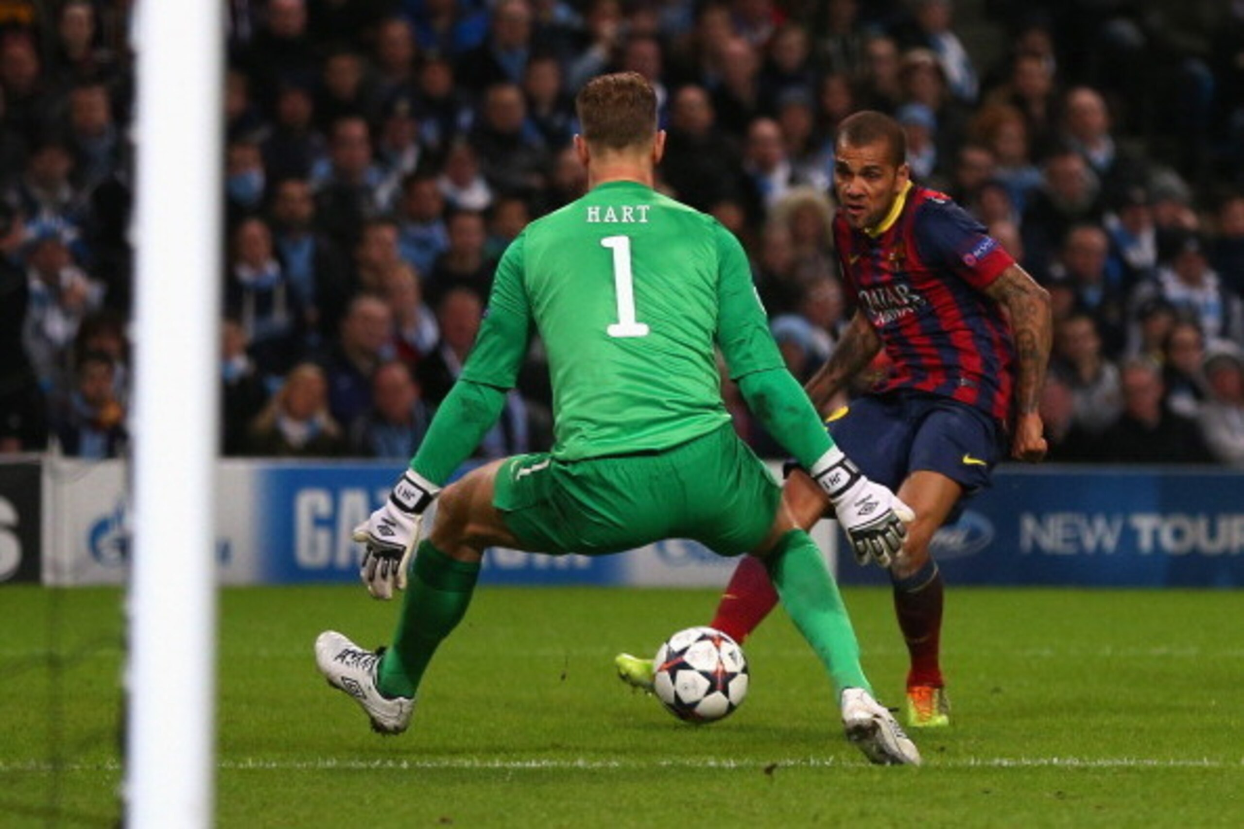 MANCHESTER, ENGLAND - FEBRUARY 18:  Daniel Alves of Barcelona scores his team's second goal during the UEFA Champions League Round of 16 first leg match between Manchester City and Barcelona at the Etihad Stadium on February 18, 2014 in Manchester, Englan