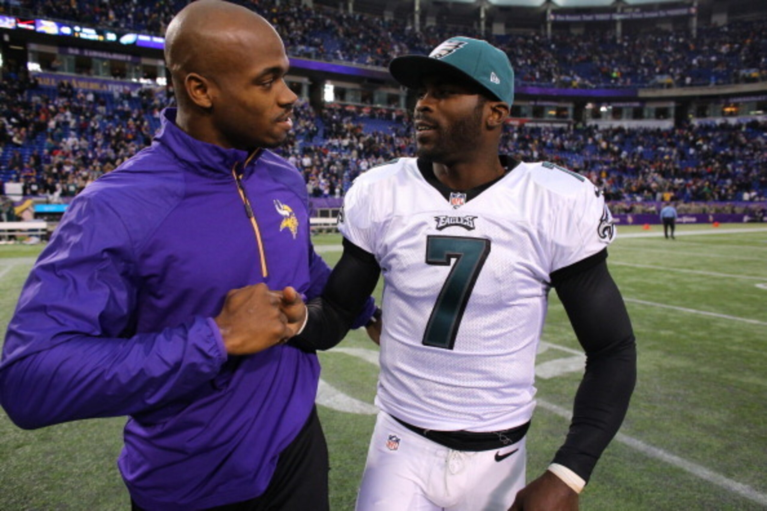 MINNEAPOLIS, MN - DECEMBER 15:  Adrian Peterson #28 of the Minnesota Vikings greets Michael Vick #7 of the Philadelphia Eagles after the game on December 15, 2013 at Mall of America Field at the Hubert H. Humphrey Metrodome in Minneapolis, Minnesota. (Pho