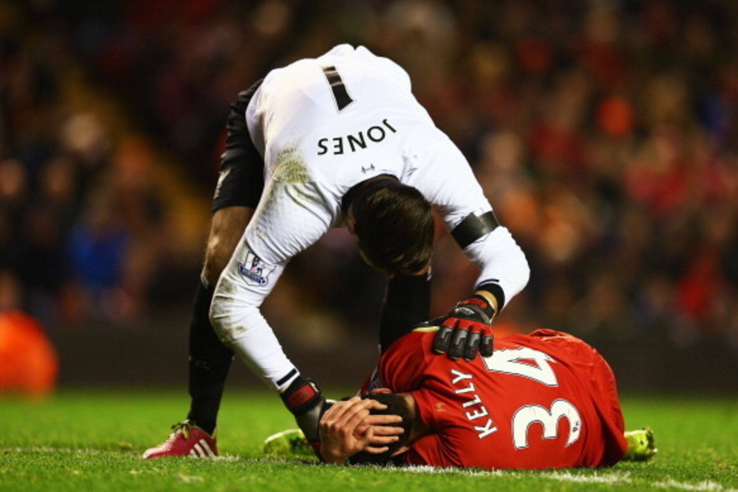 LIVERPOOL, ENGLAND - JANUARY 05:  Martin Kelly of Liverpool holds his head as Brad Jones of Liverpool shows concern during the Budweiser FA Cup third round match between Liverpool and Oldham Athletic at Anfield on January 5, 2014 in Liverpool, England.  (
