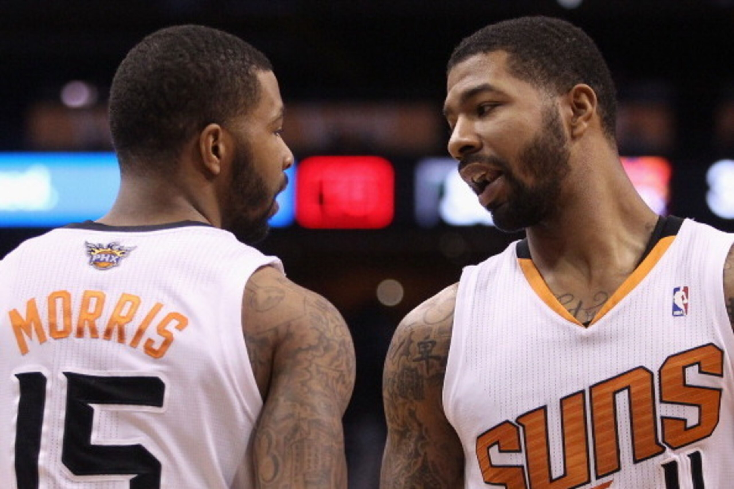 PHOENIX, AZ - DECEMBER 18:  (L-R) Marcus Morris #15 and Markieff Morris #11 of the Phoenix Suns during the NBA game against the San Antonio Spurs at US Airways Center on December 18, 2013 in Phoenix, Arizona. The Spurs defeated the Suns 108-101. NOTE TO U