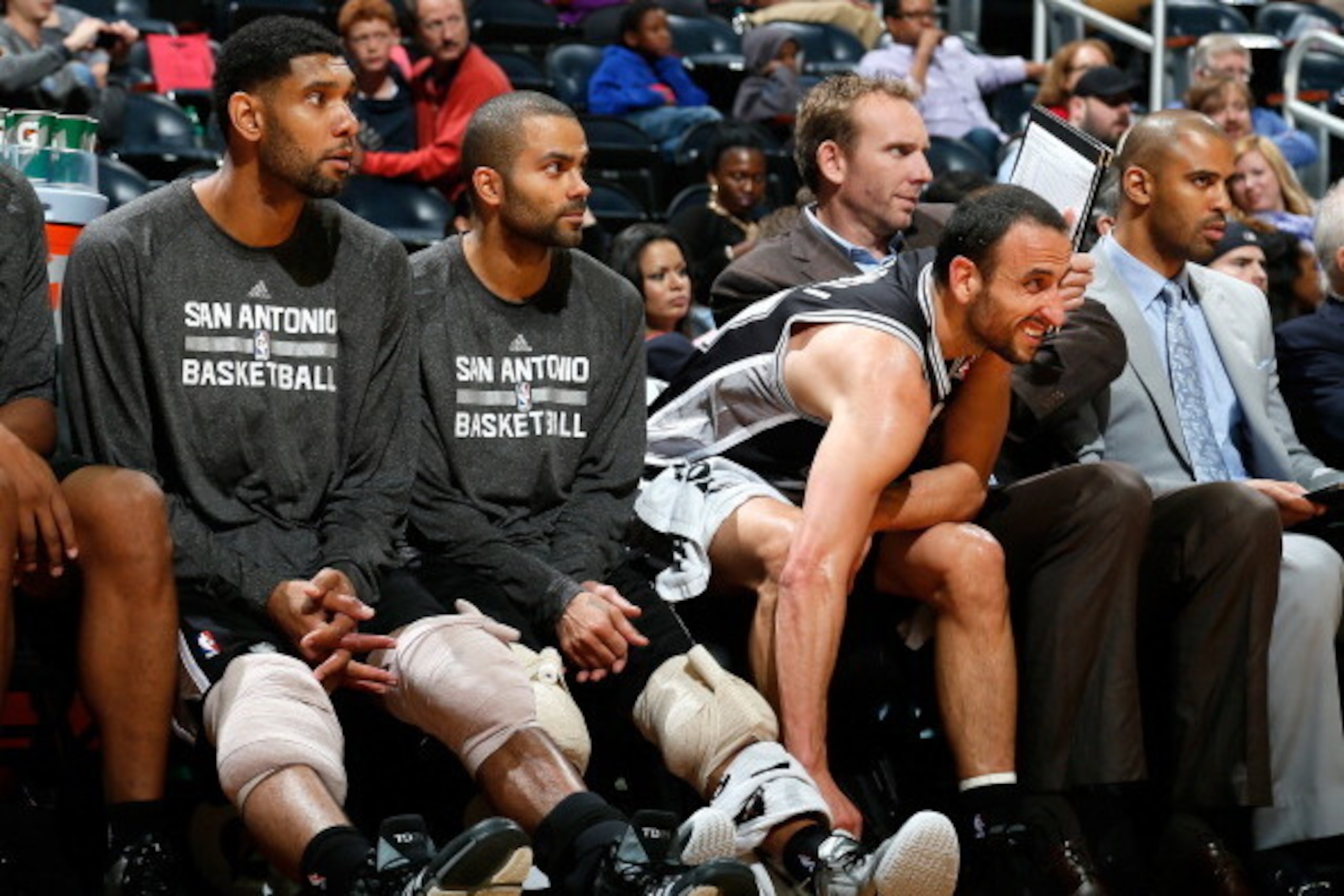 ATLANTA, GA - OCTOBER 17:  Tim Duncan #21, Tony Parker #9 and Manu Ginobili #20 of the San Antonio Spurs sit on the bench during the game against the Atlanta Hawks at Philips Arena on October 17, 2013 in Atlanta, Georgia.  NOTE TO USER: User expressly ack