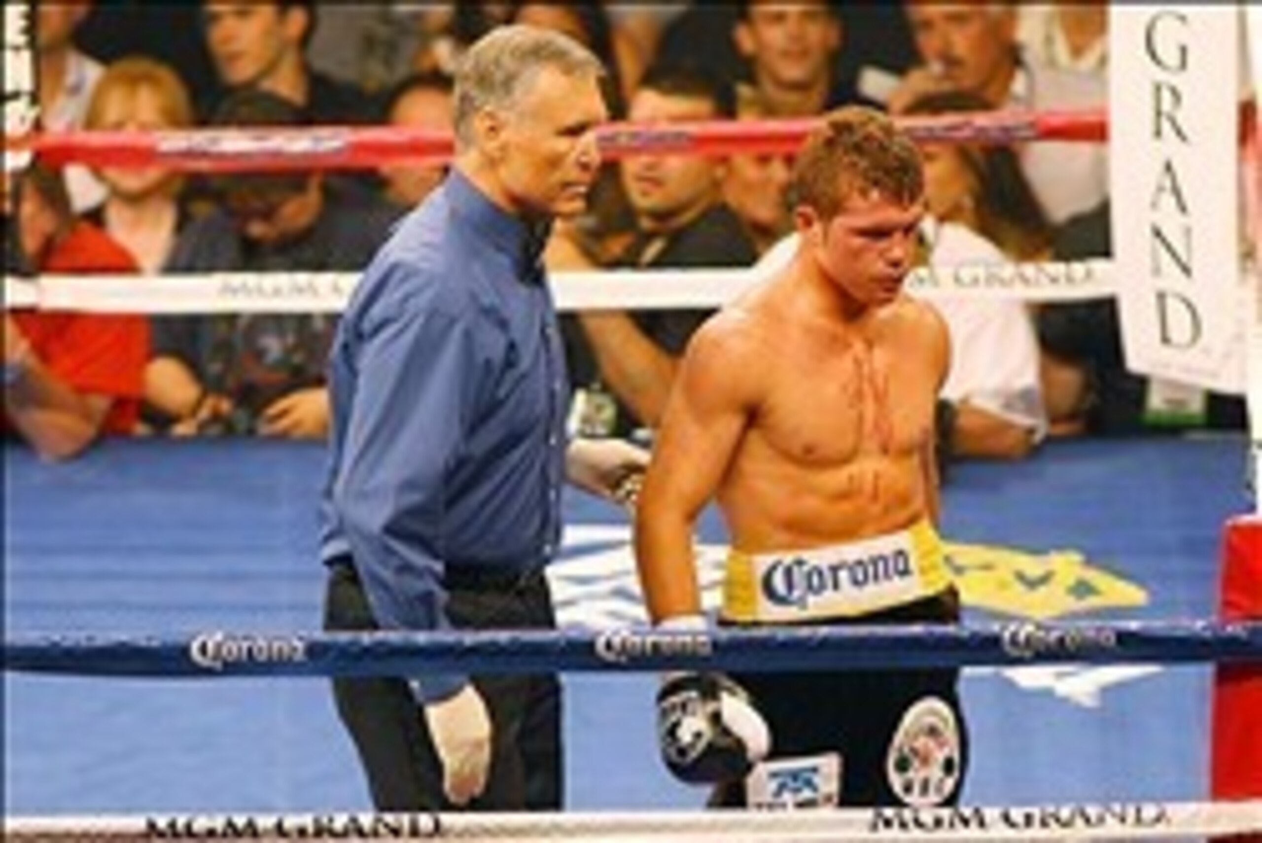 May 5, 2012; Las Vegas, NV, USA; Canelo Alvarez (right) goes to his corner to during the third round against Shane Mosley at MGM Grand Garden Arena. Mandatory Credit: Jake Roth-USA TODAY Sports
