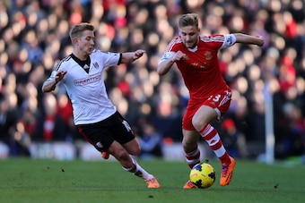 LONDON, ENGLAND - FEBRUARY 01:  Luke Shaw of Southampton in action against Lewis Holtby of Fulham during the Barclays Premier League match between Fulham and Southampton at Craven Cottage on February 1, 2014 in London, England.  (Photo by Ian Walton/Getty