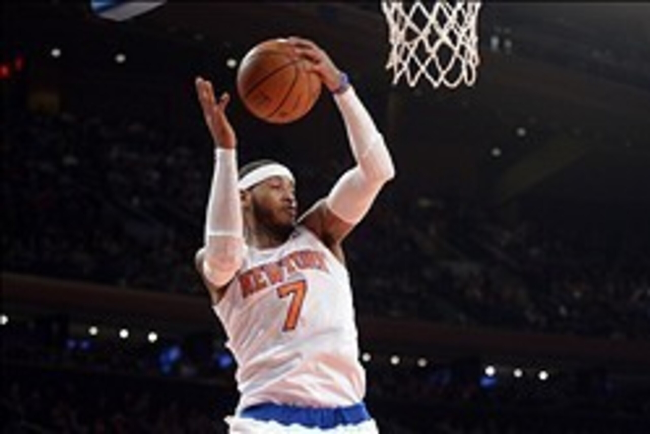 Feb 7, 2014; New York, NY, USA; New York Knicks small forward Carmelo Anthony (7) grabs a rebound against the Denver Nuggets during the first half at Madison Square Garden. Mandatory Credit: Joe Camporeale-USA TODAY Sports