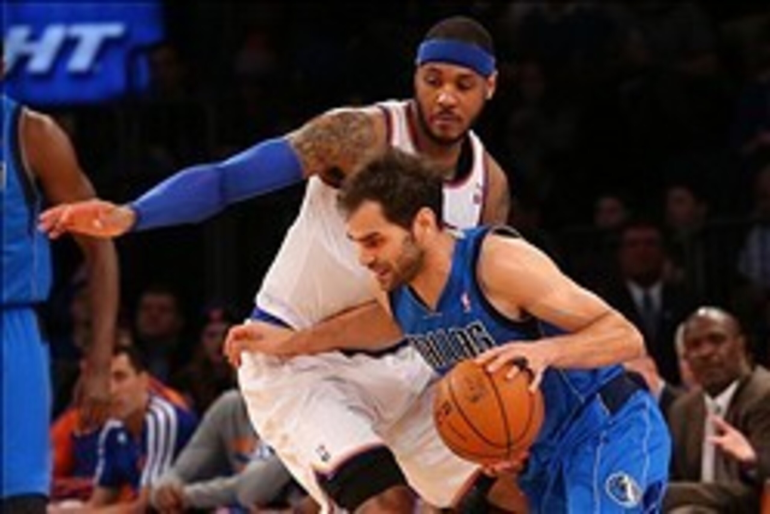 Feb 24, 2014; New York, NY, USA; Dallas Mavericks point guard Jose Calderon (8) dribbles the ball past New York Knicks small forward Carmelo Anthony (7) during the third quarter at Madison Square Garden. Dallas Mavericks won 110-108.  Mandatory Credit: An