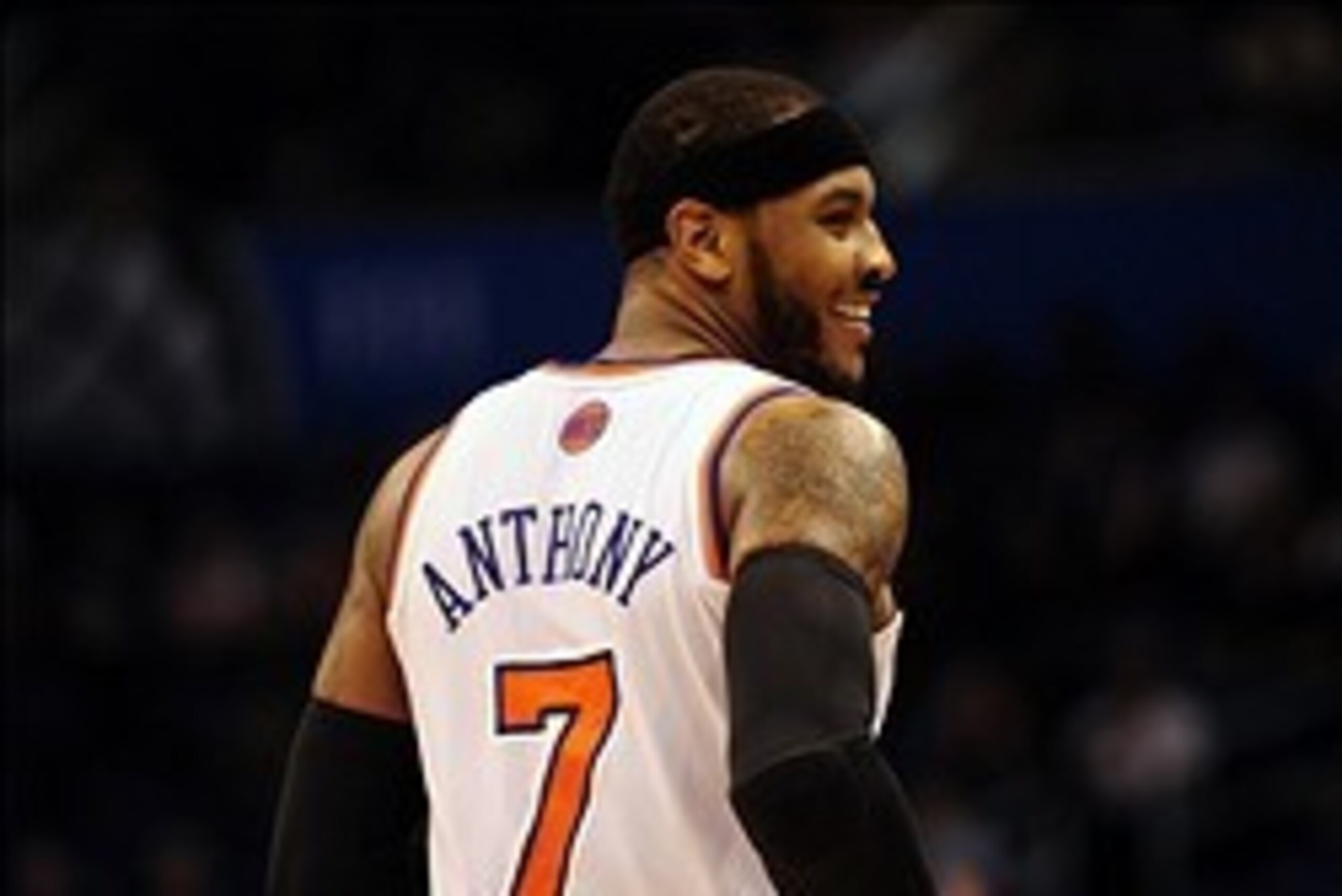Feb 21, 2014; Orlando, FL, USA; New York Knicks small forward Carmelo Anthony (7) smiles in the second half as the Orlando Magic beat the New York Knicks 129-121 in double overtime at Amway Center. Anthony had a game-high 44 points. Mandatory Credit: Davi