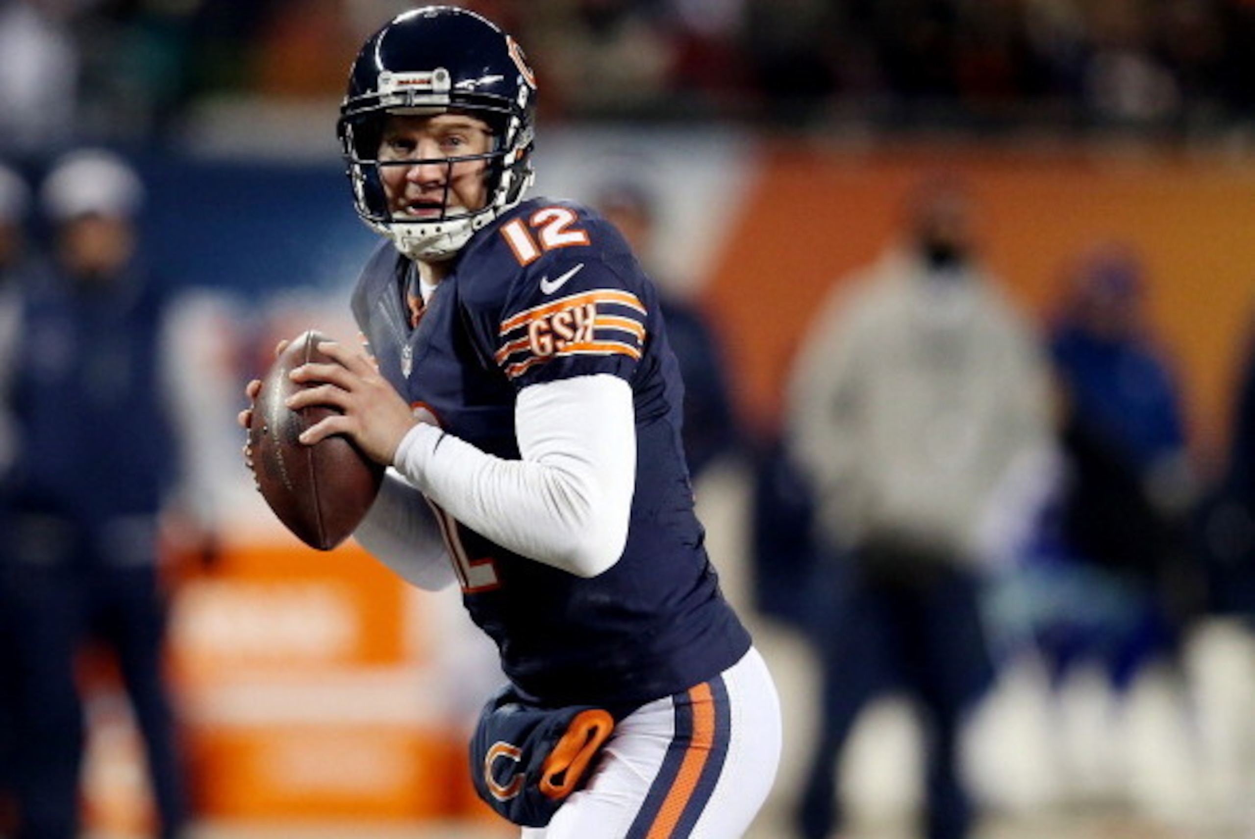 CHICAGO, IL - DECEMBER 09: Quarterback Josh McCown #12 of the Chicago Bears looks to pass against the Dallas Cowboys during a game at Soldier Field on December 9, 2013 in Chicago, Illinois.  (Photo by Jonathan Daniel/Getty Images)