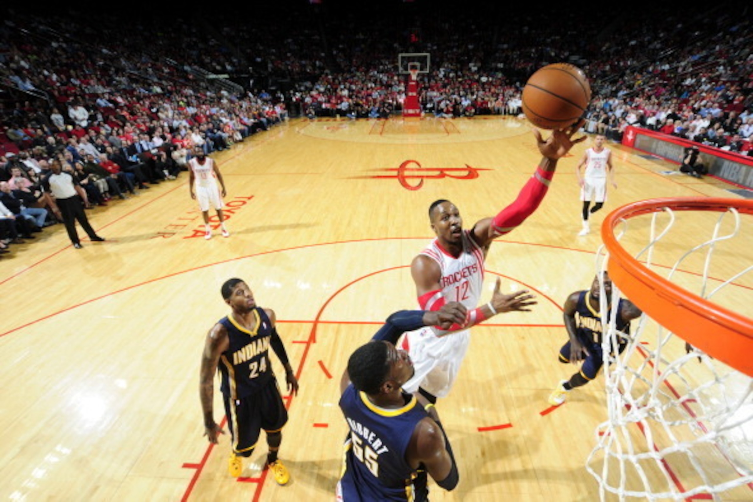HOUSTON, TX - MARCH 7:  Dwight Howard #12 of the Houston Rockets shoots against the Indiana Pacers on March 7, 2014 at the Toyota Center in Houston, Texas. NOTE TO USER: User expressly acknowledges and agrees that, by downloading and or using this photogr