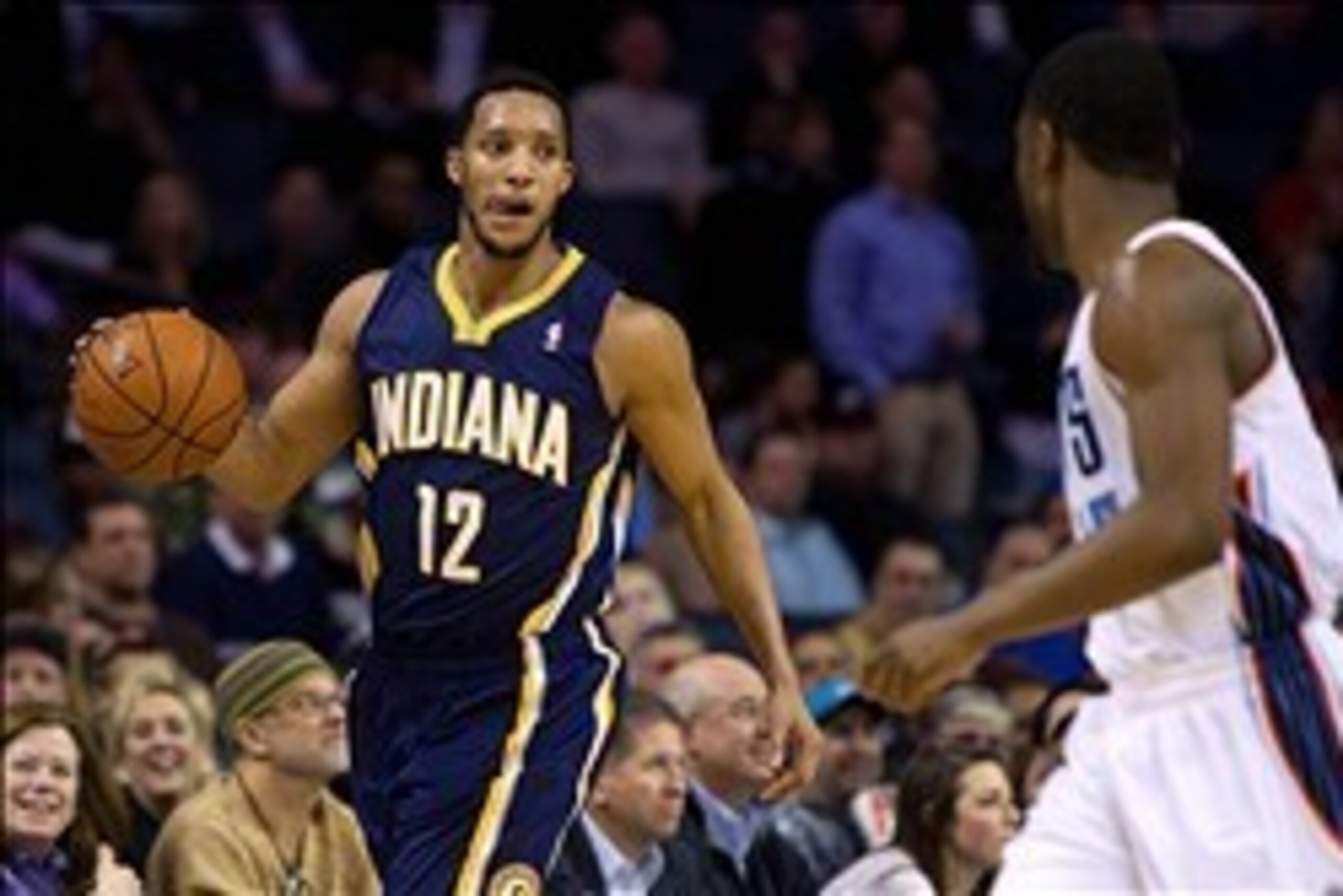 Mar 5, 2014; Charlotte, NC, USA; Indiana Pacers small forward Evan Turner (12) looks to pass the ball during the second half against the Charlotte Bobcats at Time Warner Cable Arena. Bobcats won 109-87. Mandatory Credit: Joshua S. Kelly-USA TODAY Sports