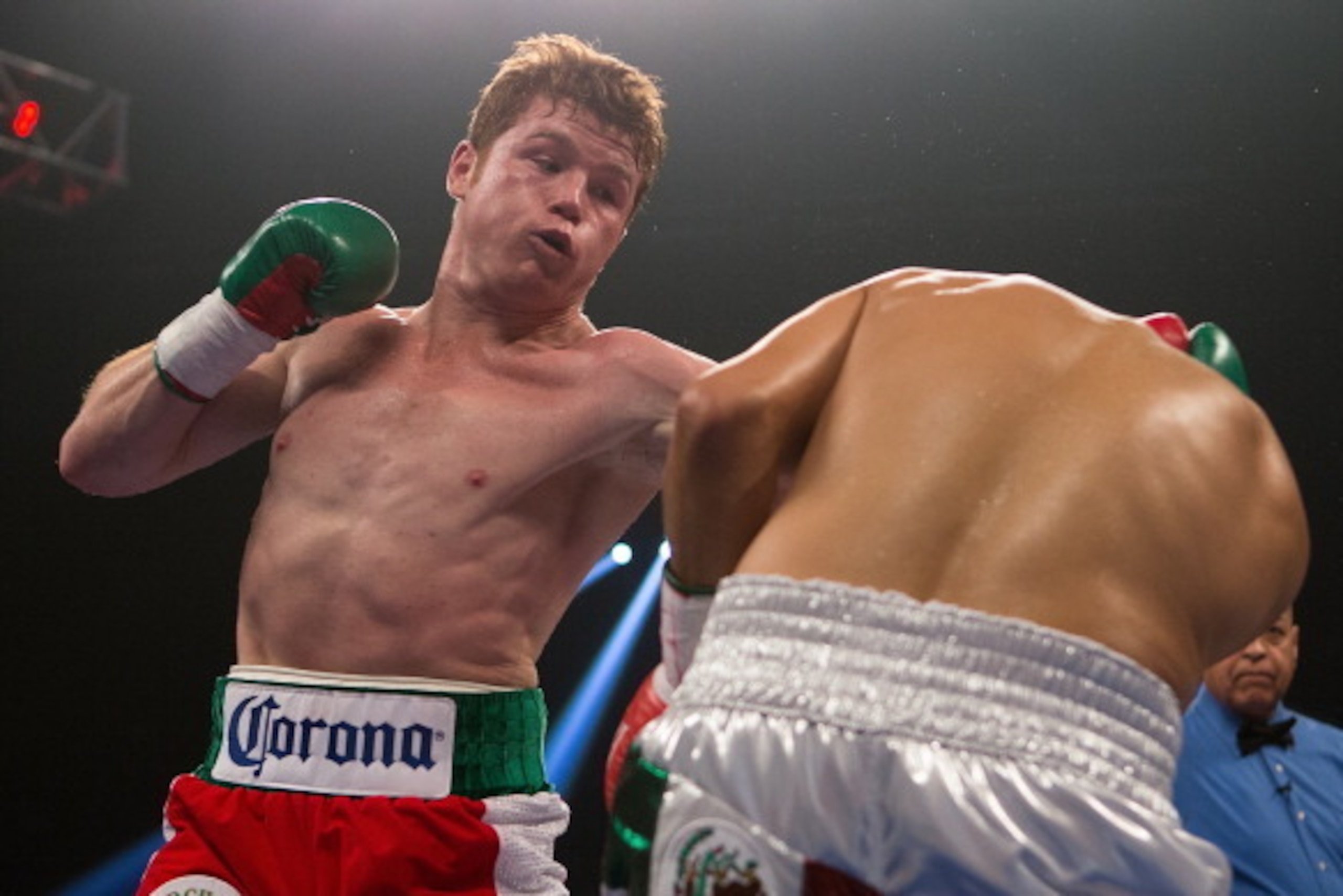 LAS VEGAS, NV - SEPTEMBER 15:  (L-R) Canelo Alvarez lands a left to the head of Josesito Lopez during their WBC super  welterweight title fight at MGM Grand Garden Arena on September 15, 2012 in Las Vegas, Nevada. (Photo by Josh Hedges/Getty Images)