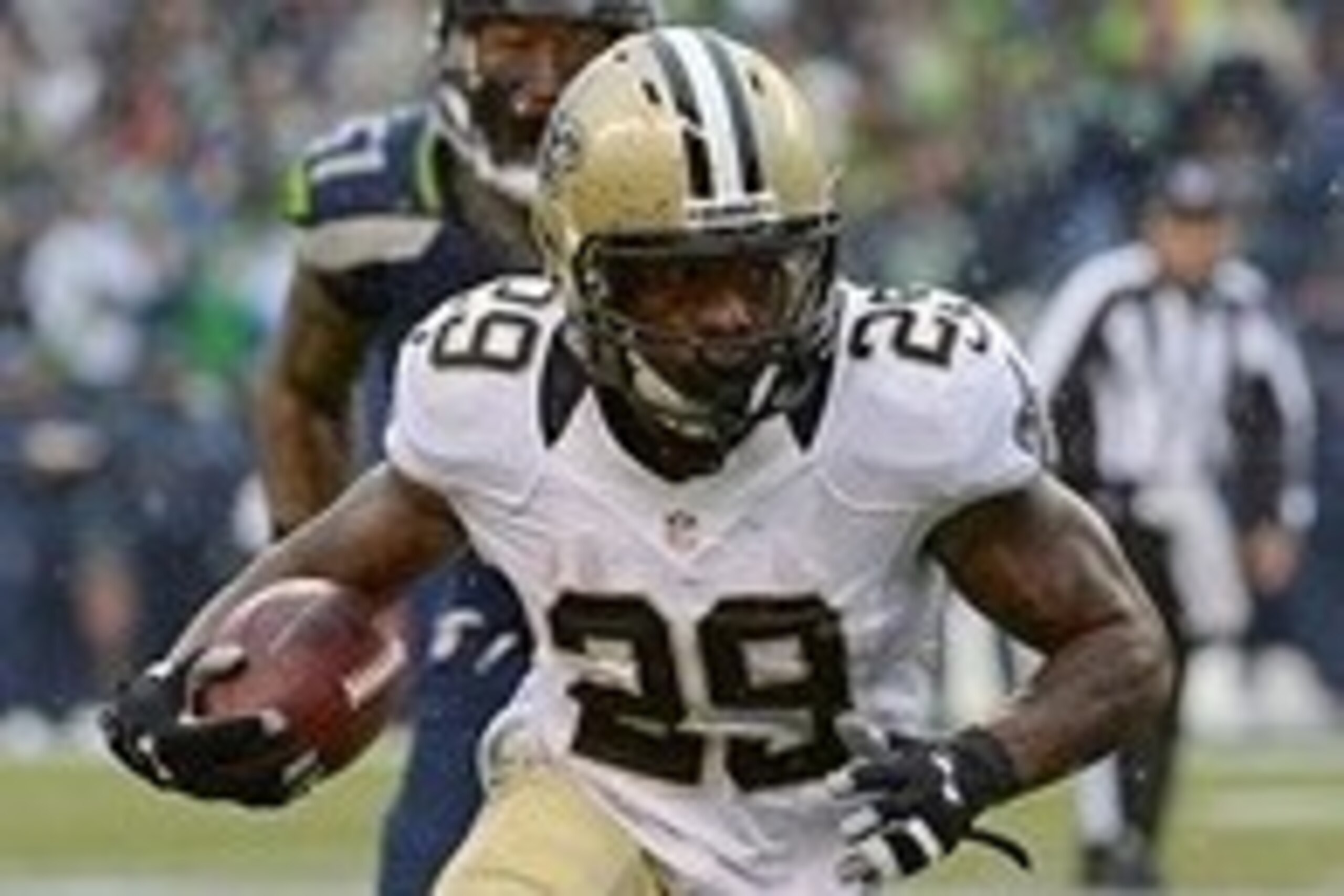 Jan 11, 2014; Seattle, WA, USA; New Orleans Saints running back Khiry Robinson (29) runs the ball against Seattle Seahawks outside linebacker Bruce Irvin (51) during the first half of the 2013 NFC divisional playoff football game at CenturyLink Field. Man Jan 11, 2014; Seattle, WA, USA; New Orleans Saints running back Khiry Robinson (29) runs the ball against Seattle Seahawks outside linebacker Bruce Irvin (51) during the first half of the 2013 NFC divisional playoff football game at CenturyLink Field. Man
