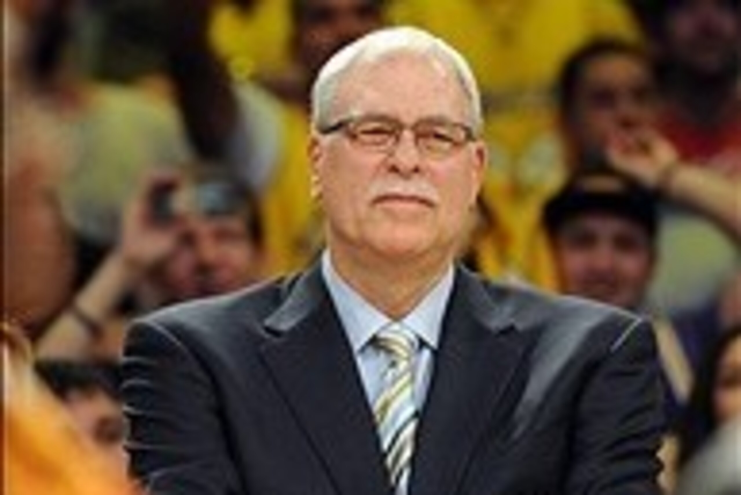 Apr 2, 2013; Los Angeles, CA, USA;   Phil Jackson looks on as the jersey of Los Angeles Lakers former player Shaquille O'Neal (not pictured) is retired during a half time ceremony during the game against the Dallas Mavericks at the Staples Center.  Mandat