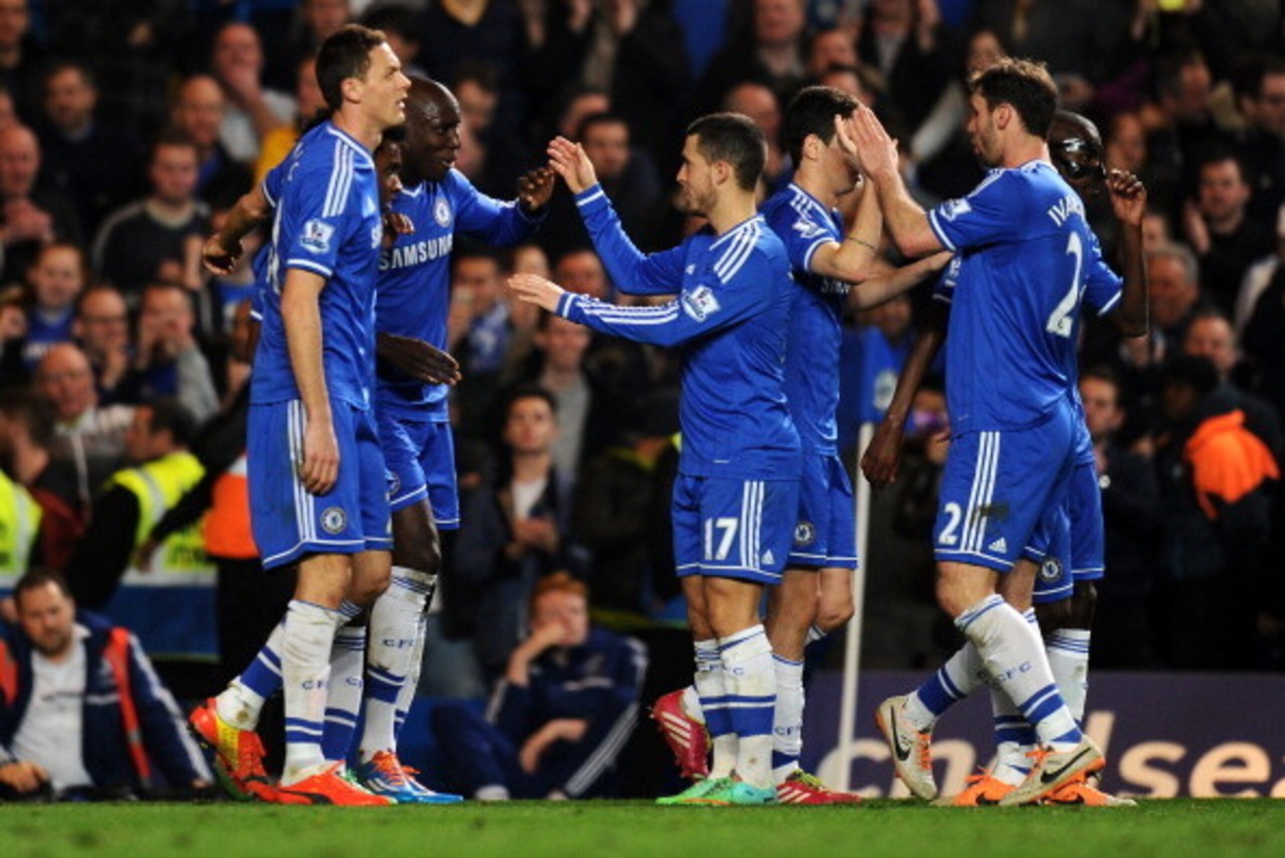 LONDON, ENGLAND - MARCH 08:  Demba Ba (3rd L) of Chelsea celebrates with teammates after scoring his team's fourth goal during the Barclays Premier League match between Chelsea and Tottenham Hotspur at Stamford Bridge on March 8, 2014 in London, England. 