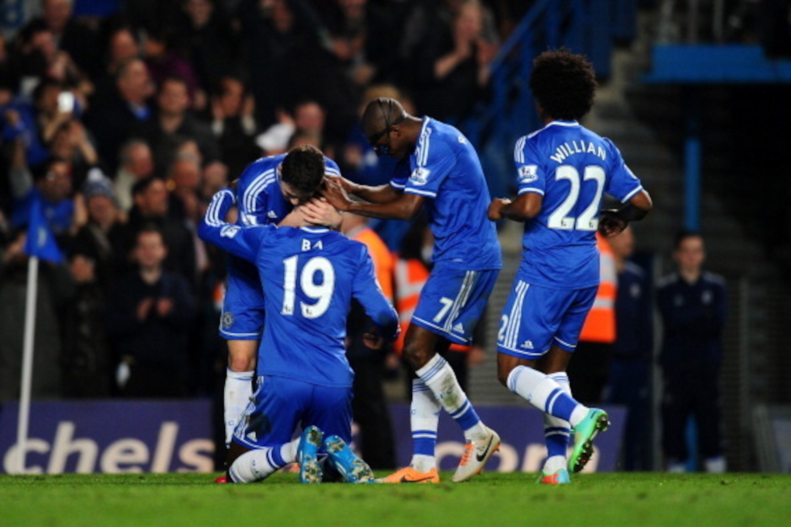 LONDON, ENGLAND - MARCH 08:  (L-R) Demba Ba #19 of Chelsea celebrates with teammates Oscar, Ramires and Willian after scoring his team's fourth goal during the Barclays Premier League match between Chelsea and Tottenham Hotspur at Stamford Bridge on March