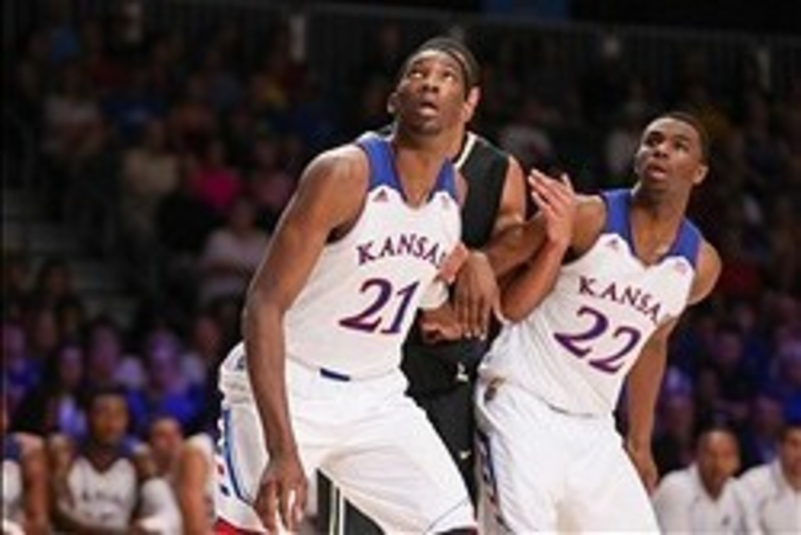 Nov 28, 2013; Paradise Island, BAHAMAS; Kansas Jayhawks center Joel Embiid (21) and guard Andrew Wiggins (22) look to rebound during the game against the Wake Forest Demon Deacons at the 2013 Battle 4 Atlantis in the Imperial Arena at the Atlantis Resort.