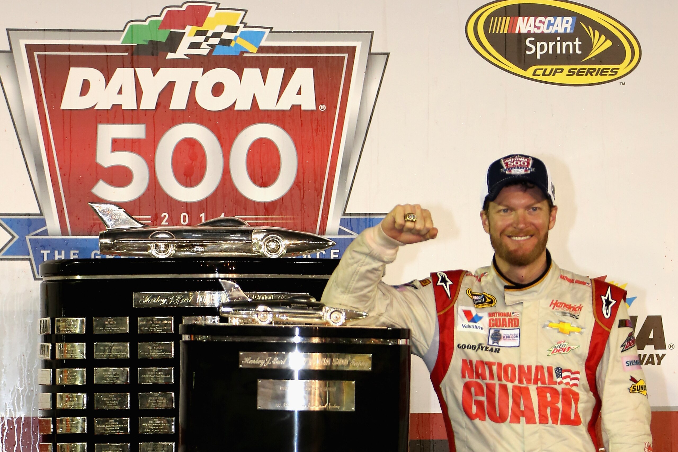 DAYTONA BEACH, FL - FEBRUARY 23:  Dale Earnhardt Jr., driver of the #88 National Guard Chevrolet, celebrates in Victory Lane with the the Harley J. Earl trophy after winning the NASCAR Sprint Cup Series Daytona 500 at Daytona International Speedway on Feb