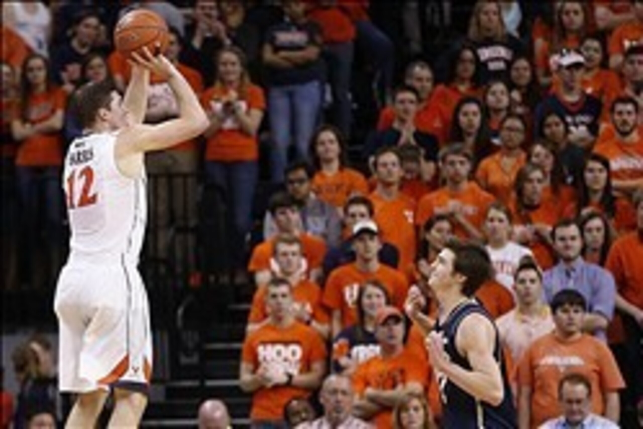 Feb 22, 2014; Charlottesville, VA, USA; Virginia Cavaliers guard Joe Harris (12) shoots the ball over Notre Dame Fighting Irish guard Steve Vasturia (32) in the first half at John Paul Jones Arena. The Cavaliers won 70-49. Mandatory Credit: Geoff Burke-US