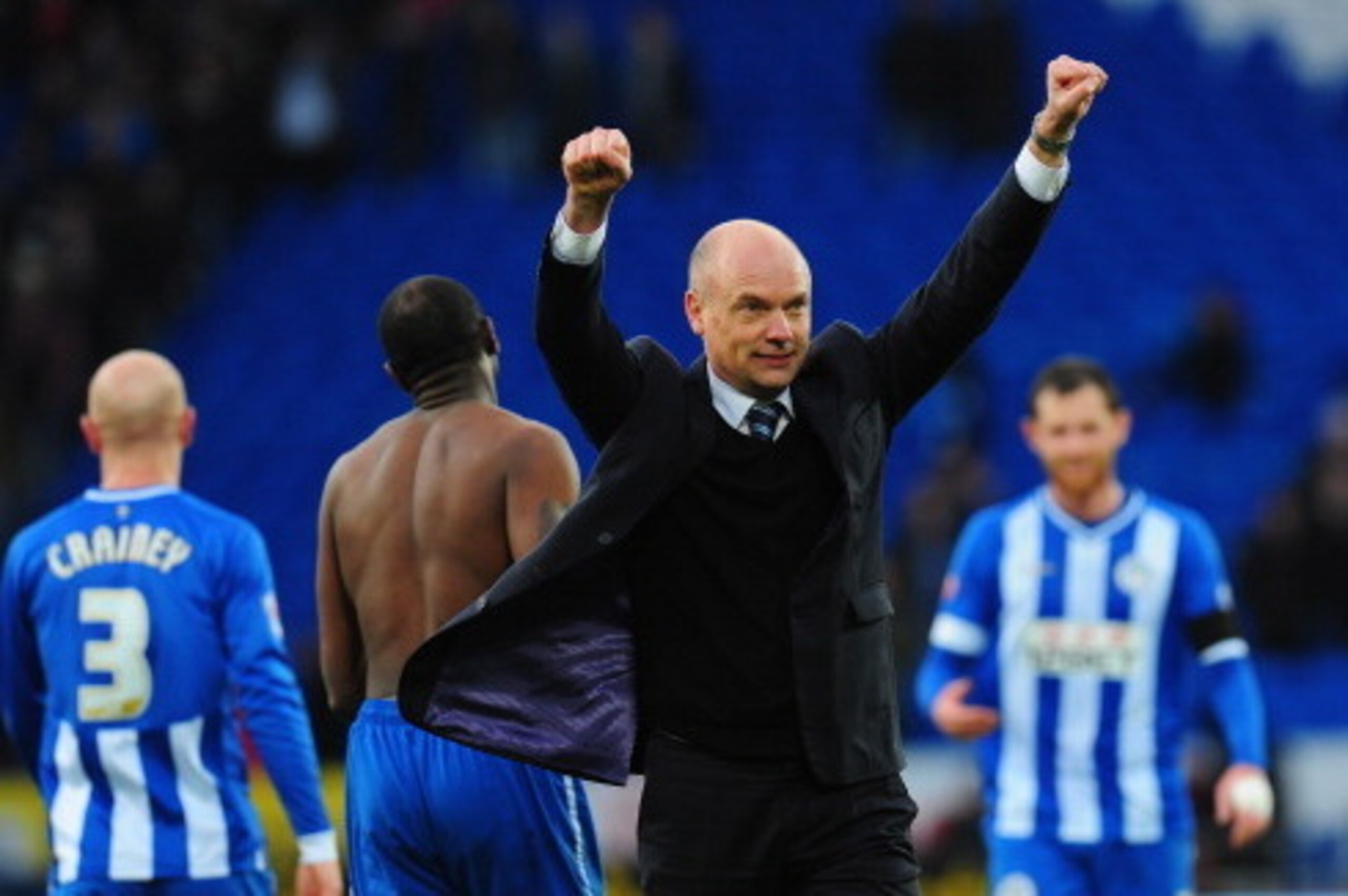 CARDIFF, WALES - FEBRUARY 15:  Wigan manager Uwe Rosler celebrates with the fans after the FA Cup Fifth Round match between Cardiff City and Wigan Athletic at Cardiff City Stadium on February 15, 2014 in Cardiff, Wales.  (Photo by Stu Forster/Getty Images