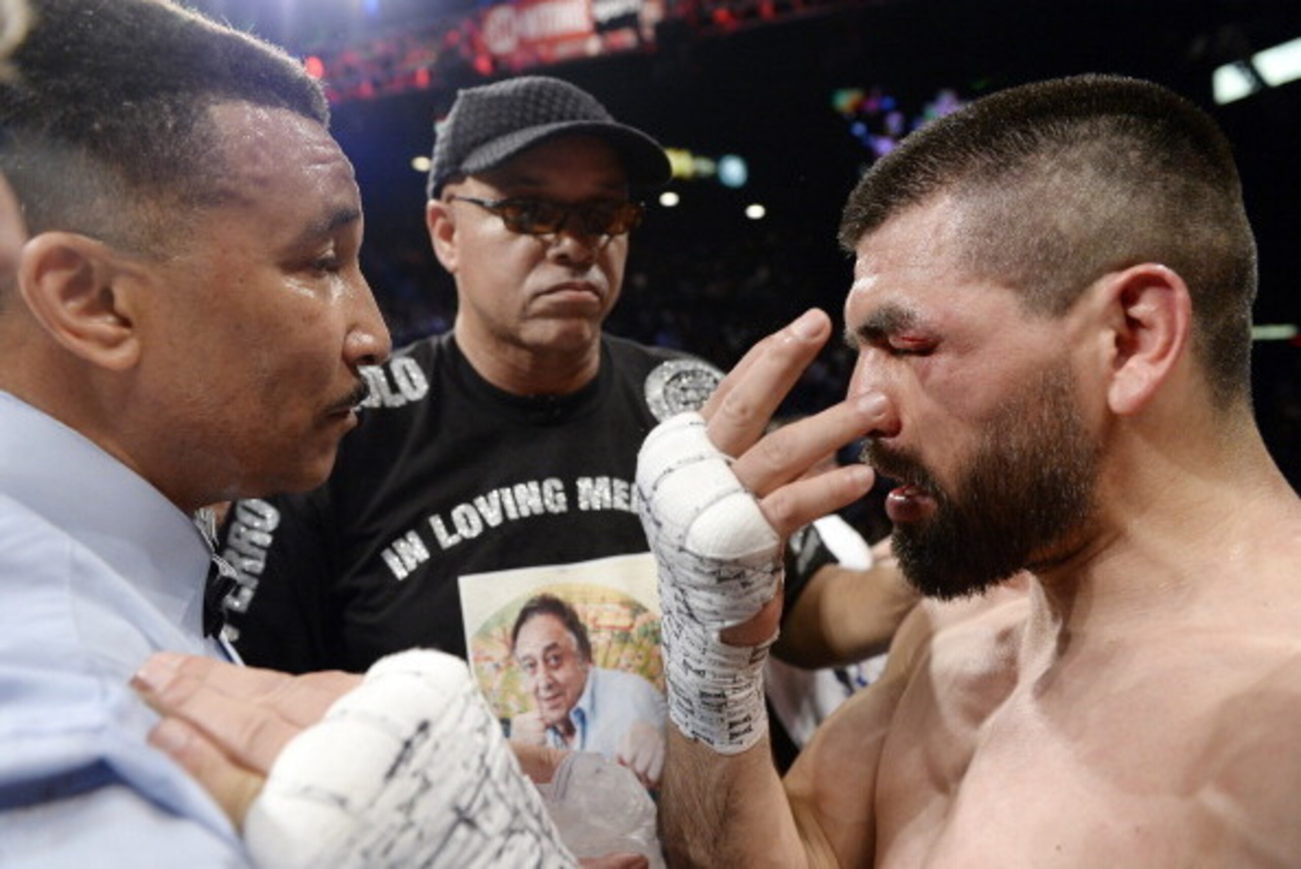 LAS VEGAS, NV - MARCH 8: Alfredo Angulo (R) has words with referee Tony Weeks (L) as trainer Virgil Hunter looks on after Weeks stopped the fight in the 10th round of the non-title, 12-round super welterweight bout against Canelo Alvarez at the MGM Grand 