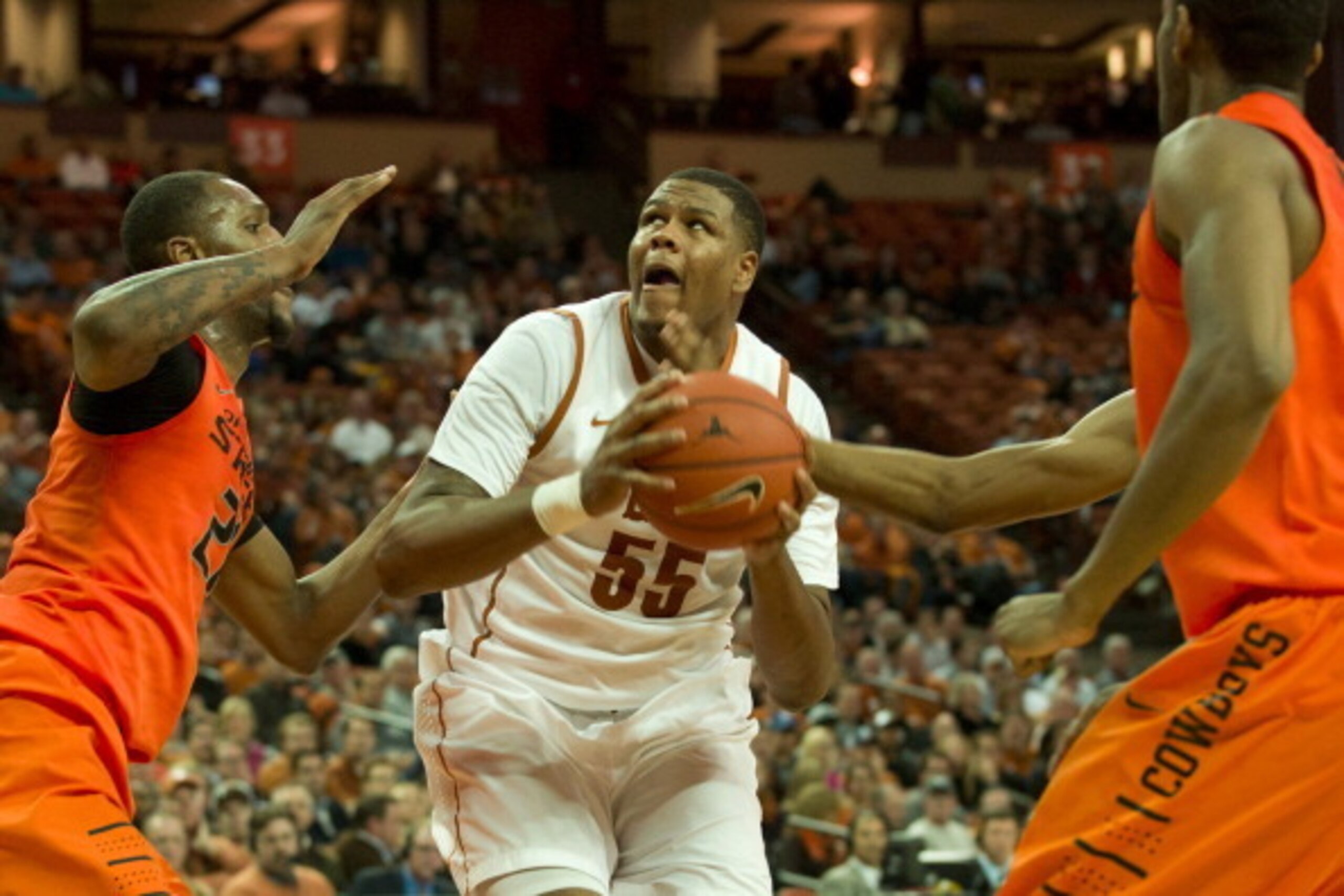 AUSTIN, TX - FEBRUARY 11: Cameron Ridley #55 of the Texas Longhorns drives to the basket against the Oklahoma State Cowboys on February 11, 2014 at the Frank Erwin Center in Austin, Texas. (Photo by Cooper Neill/Getty Images) AUSTIN, TX - FEBRUARY 11: Cameron Ridley #55 of the Texas Longhorns drives to the basket against the Oklahoma State Cowboys on February 11, 2014 at the Frank Erwin Center in Austin, Texas. (Photo by Cooper Neill/Getty Images)